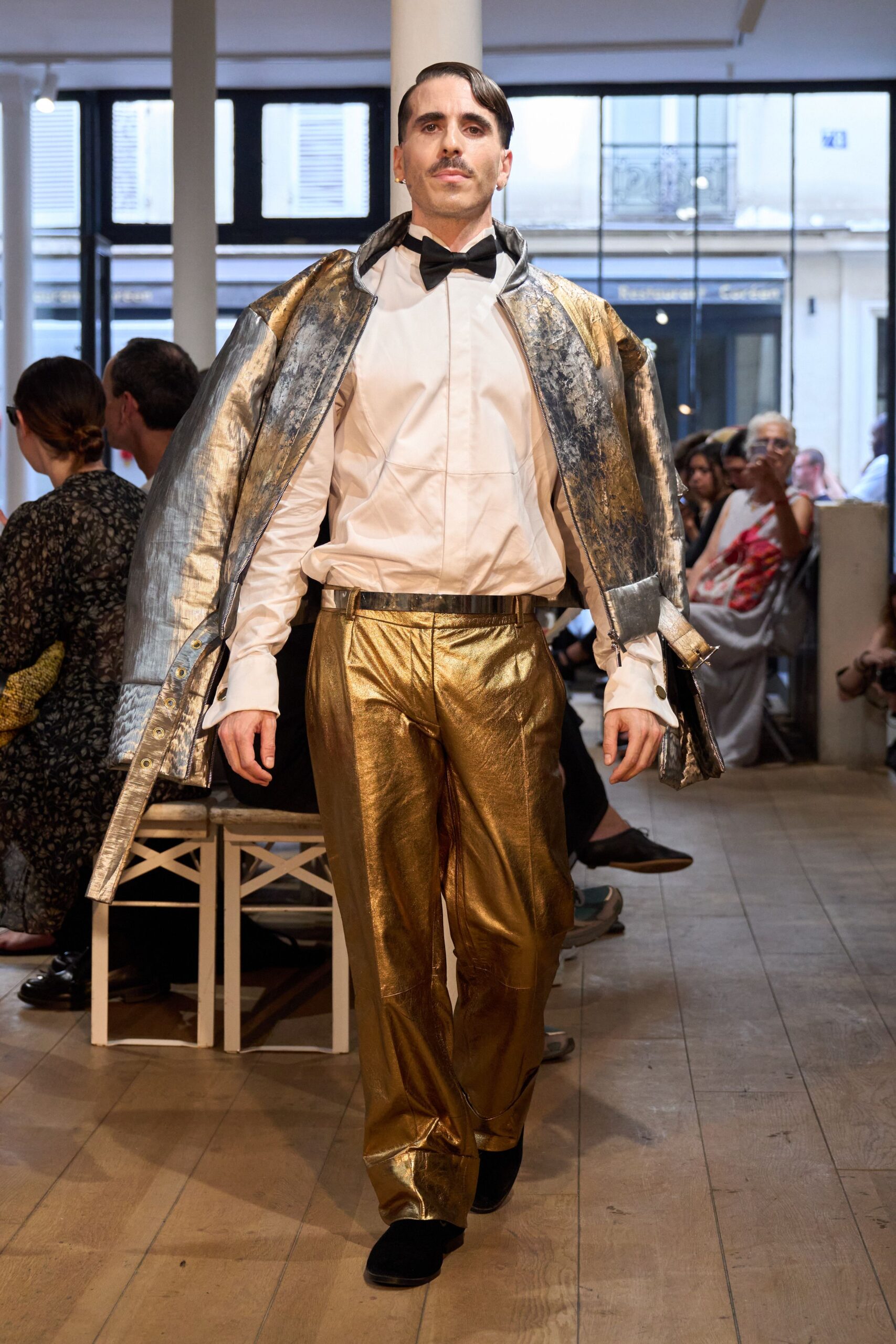 white shirt gold pants silver cape