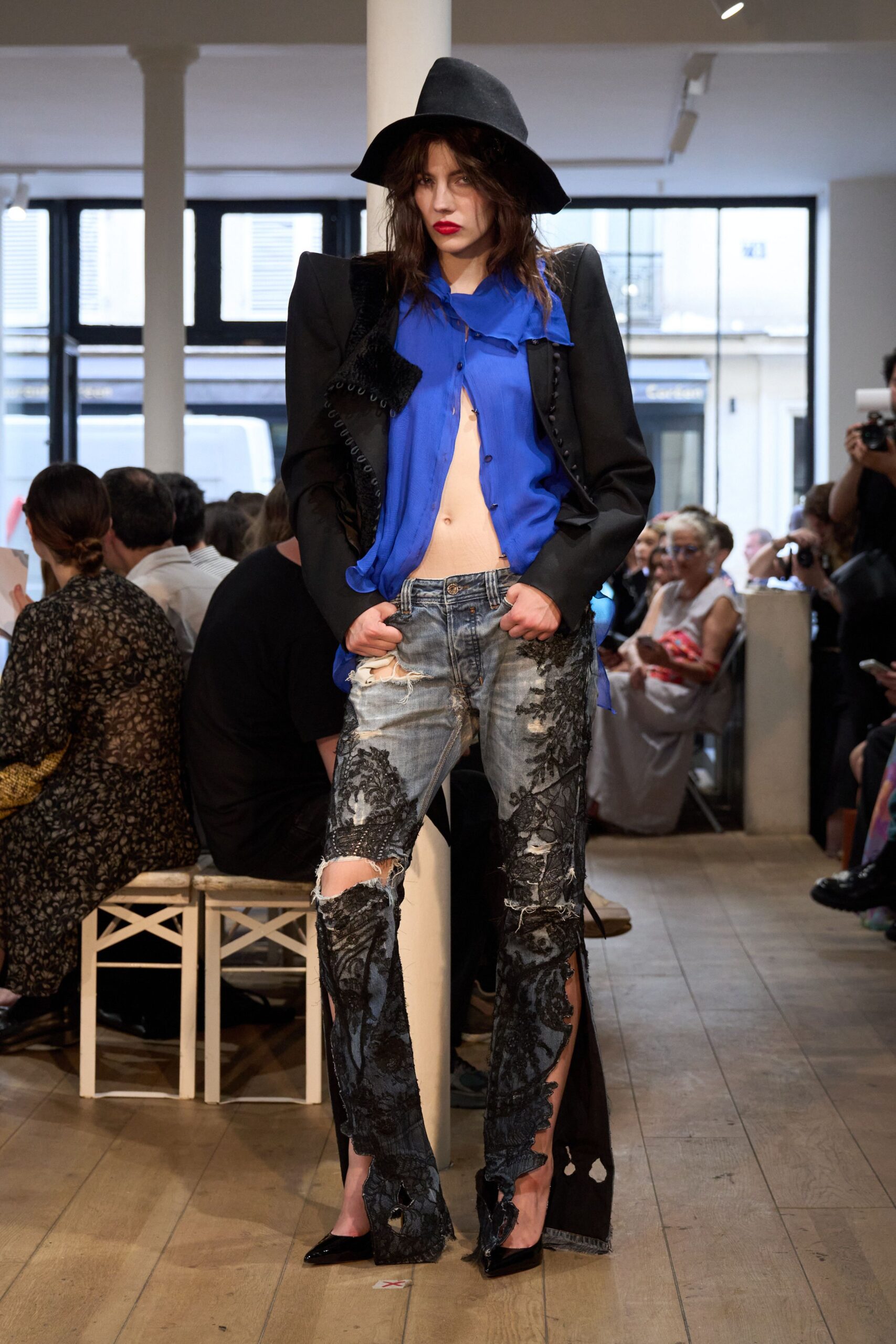 black blazer blue top distressed jeans
