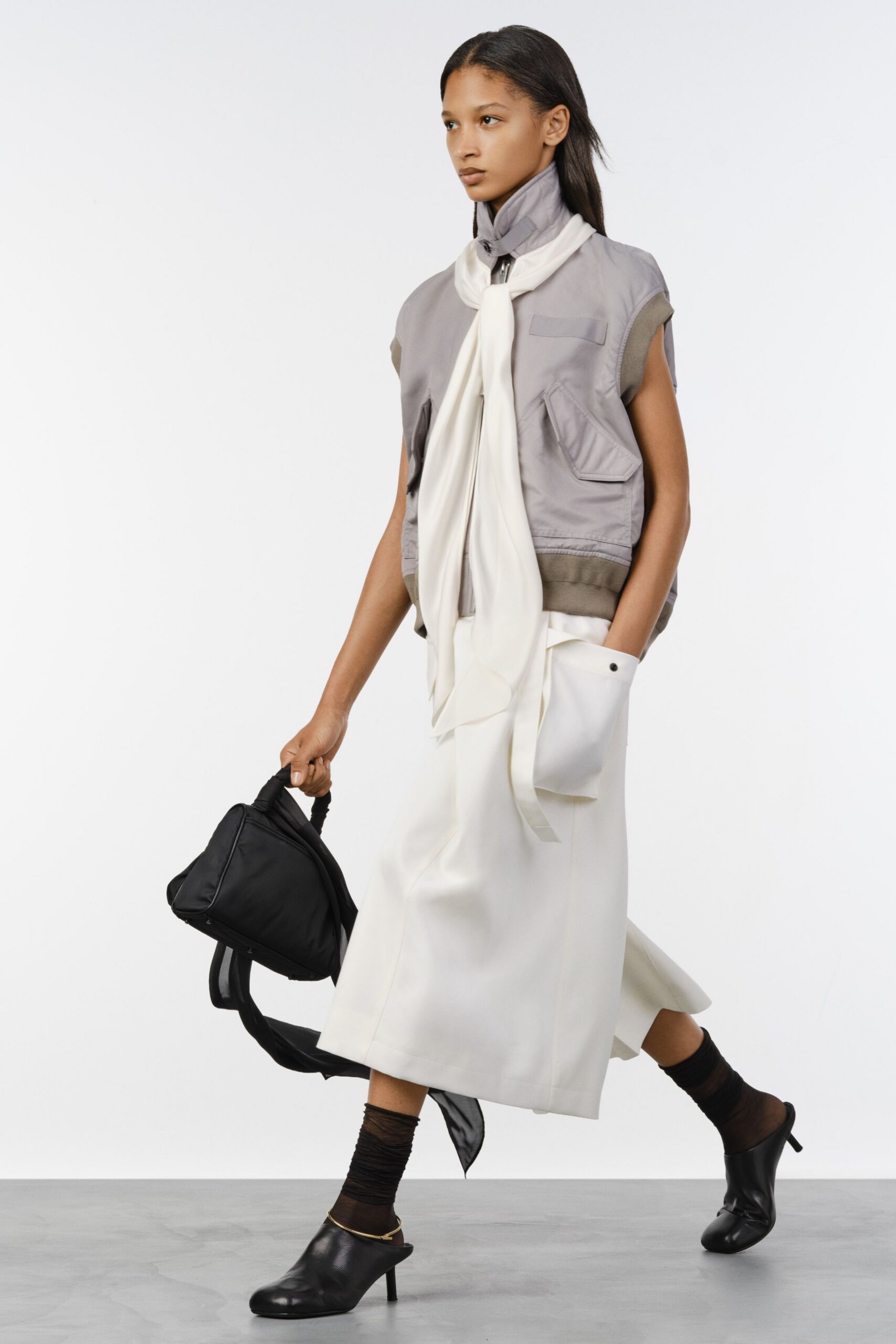 white silk sleeveless v-neck fitted draped top