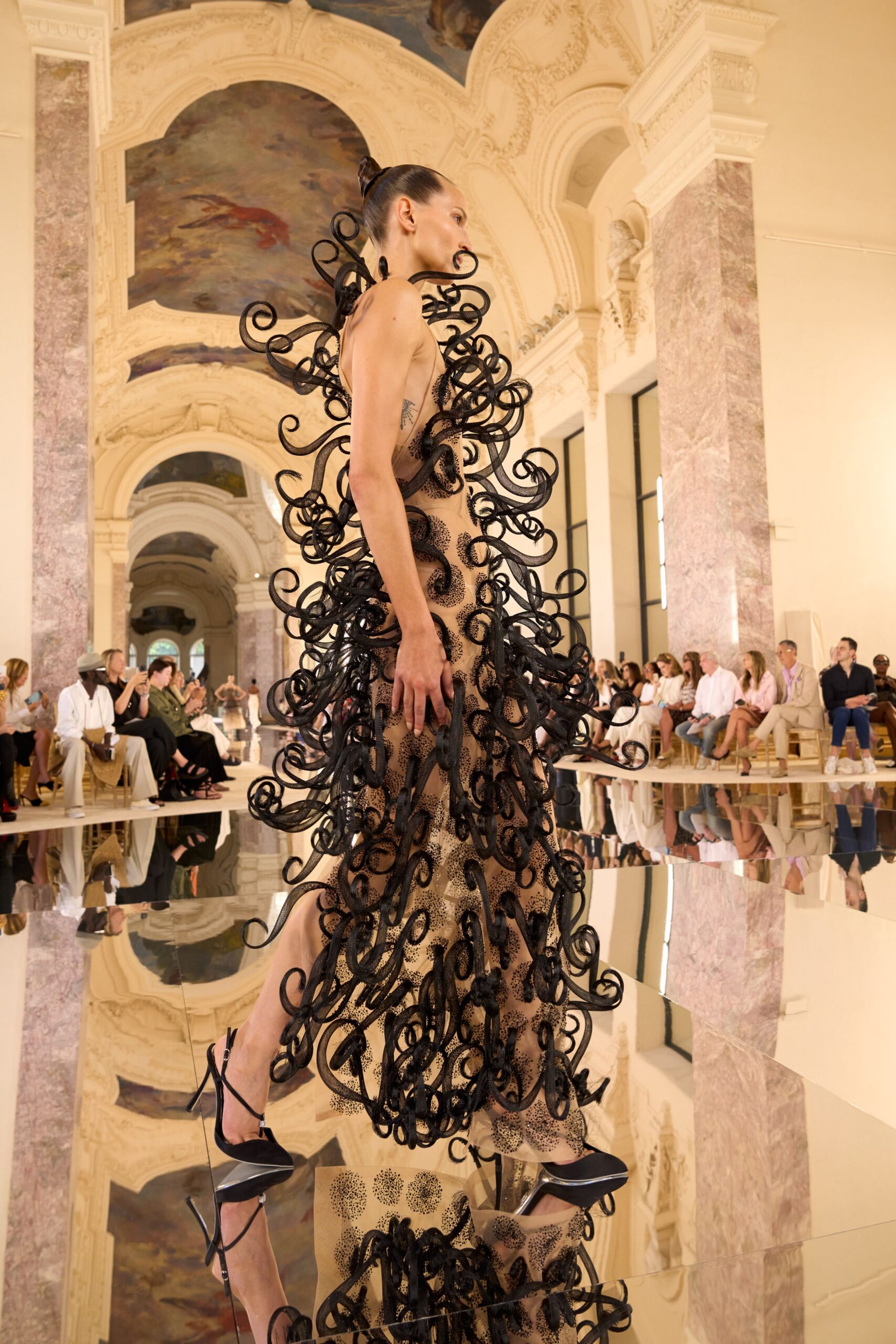 black and beige layered gown with heels