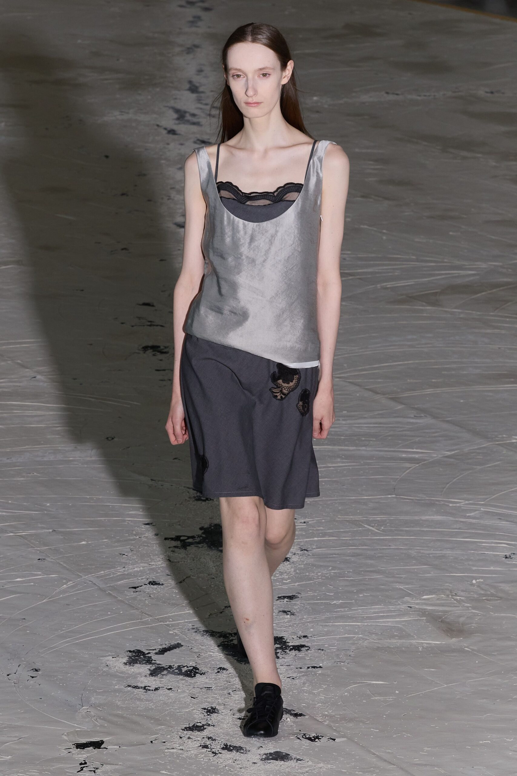 gray silk sleeveless top and black pencil skirt