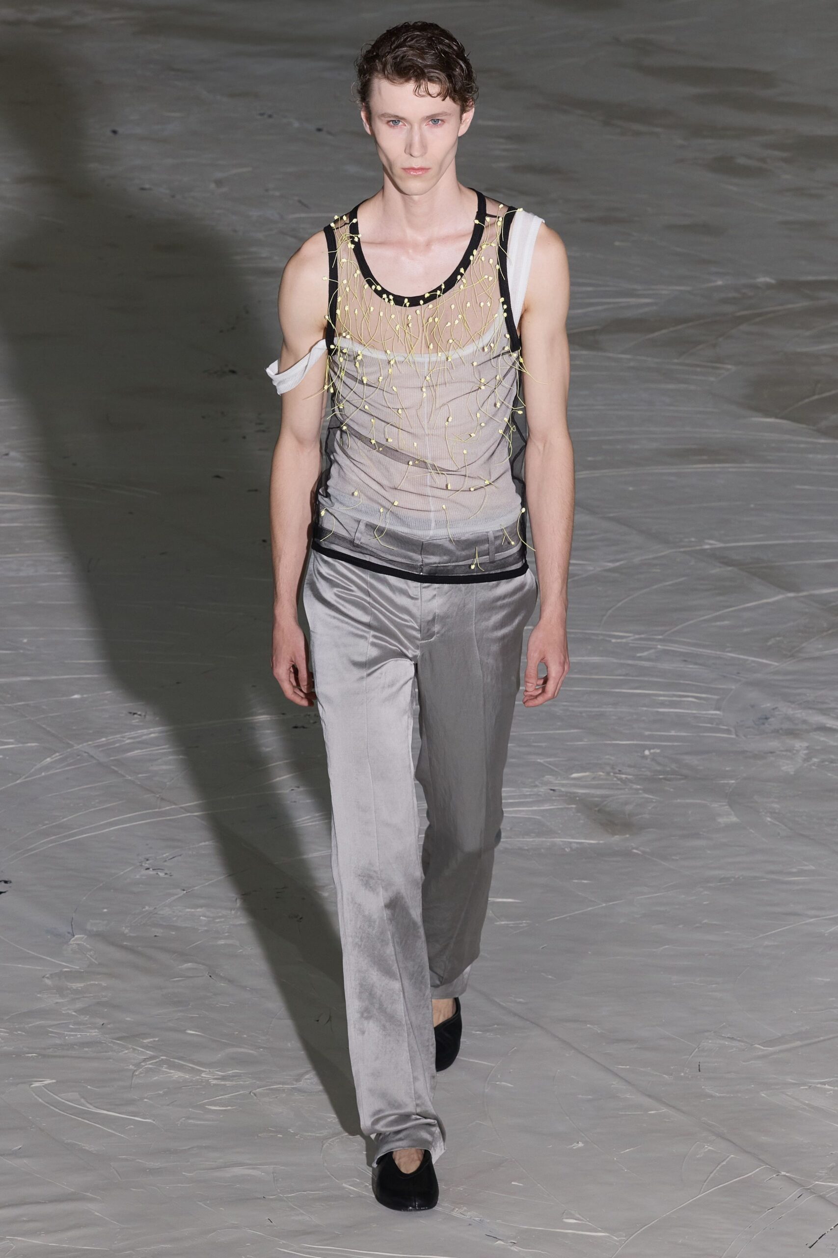 sheer black top with gray pants