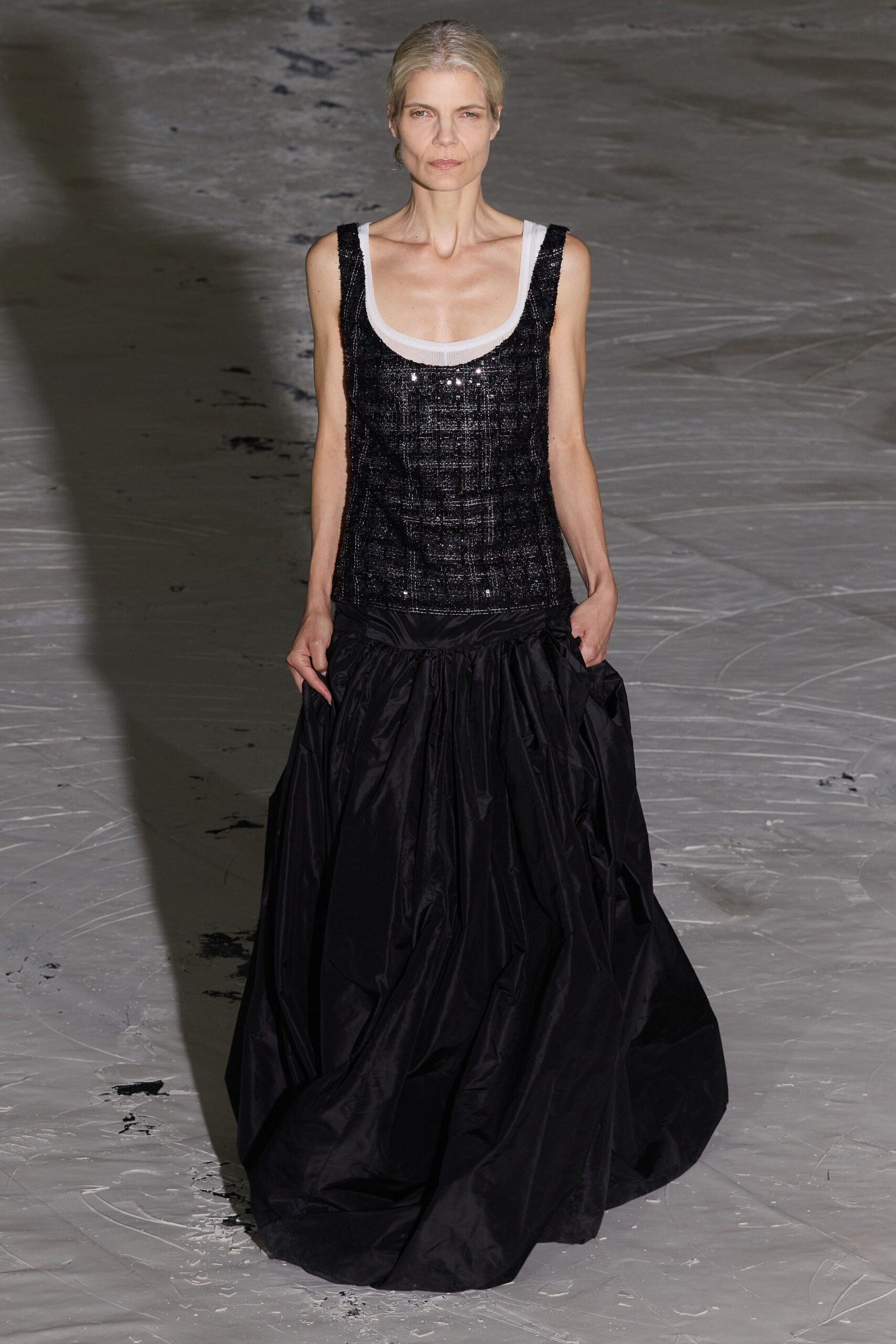 black sequined top and pleated skirt