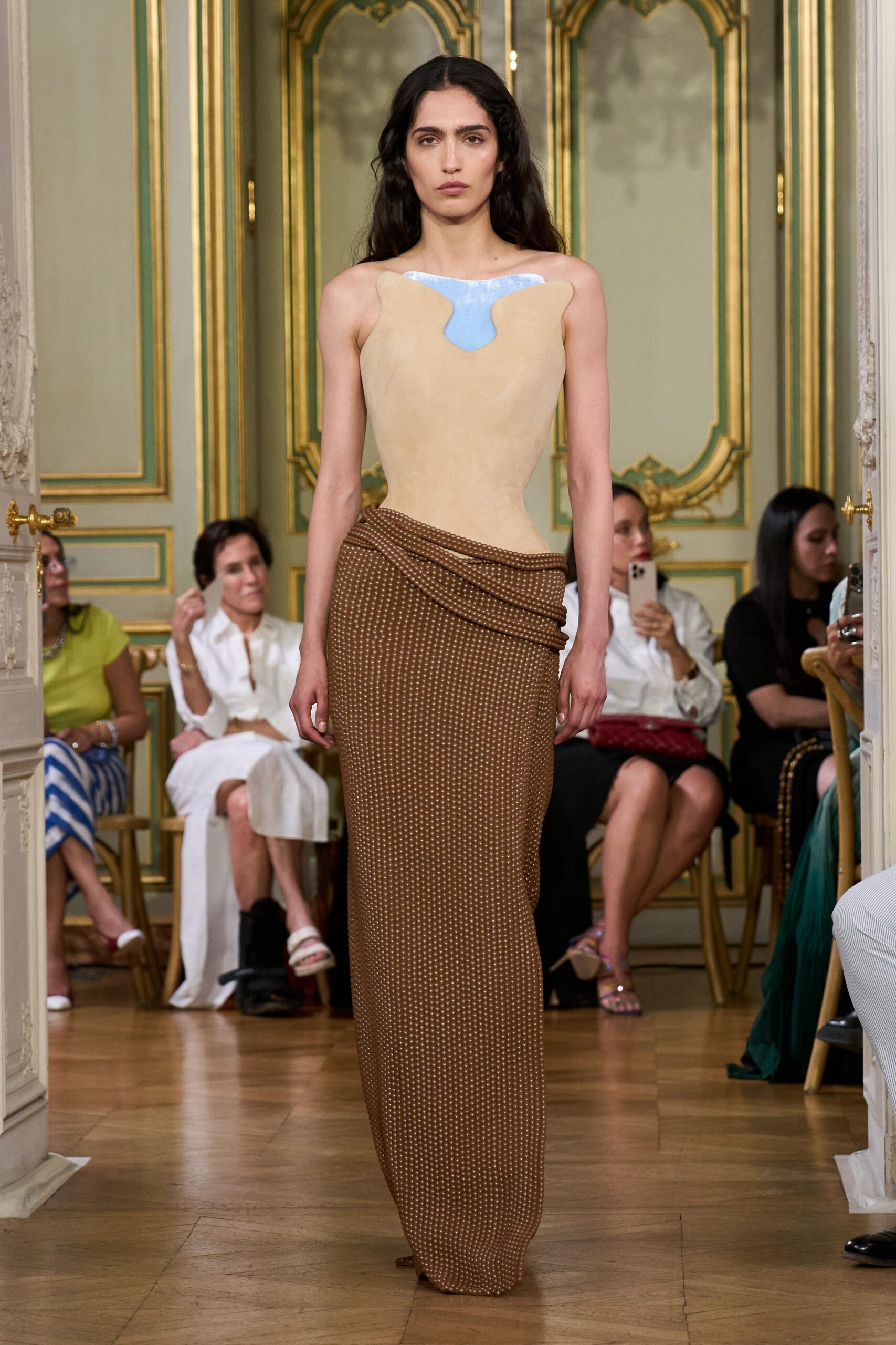 beige fitted top with brown pleated skirt