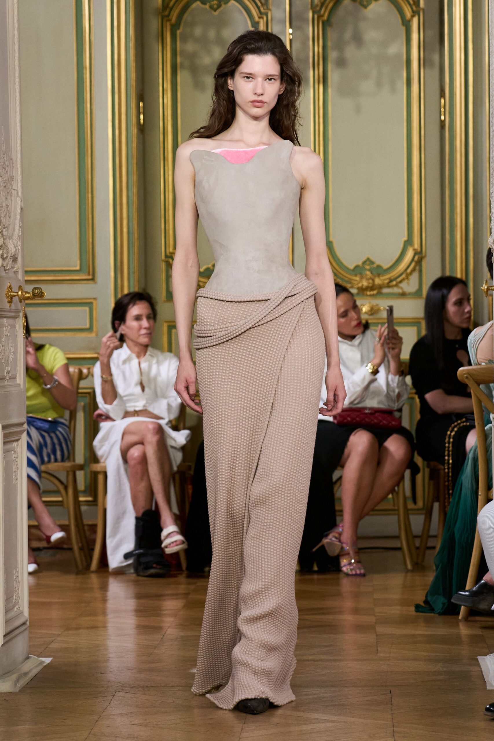 beige fitted top with pink skirt