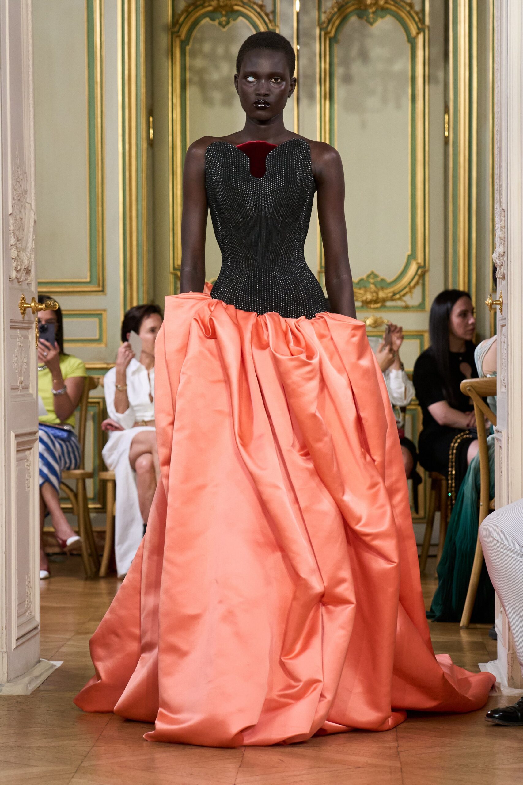 black and orange pleated gown