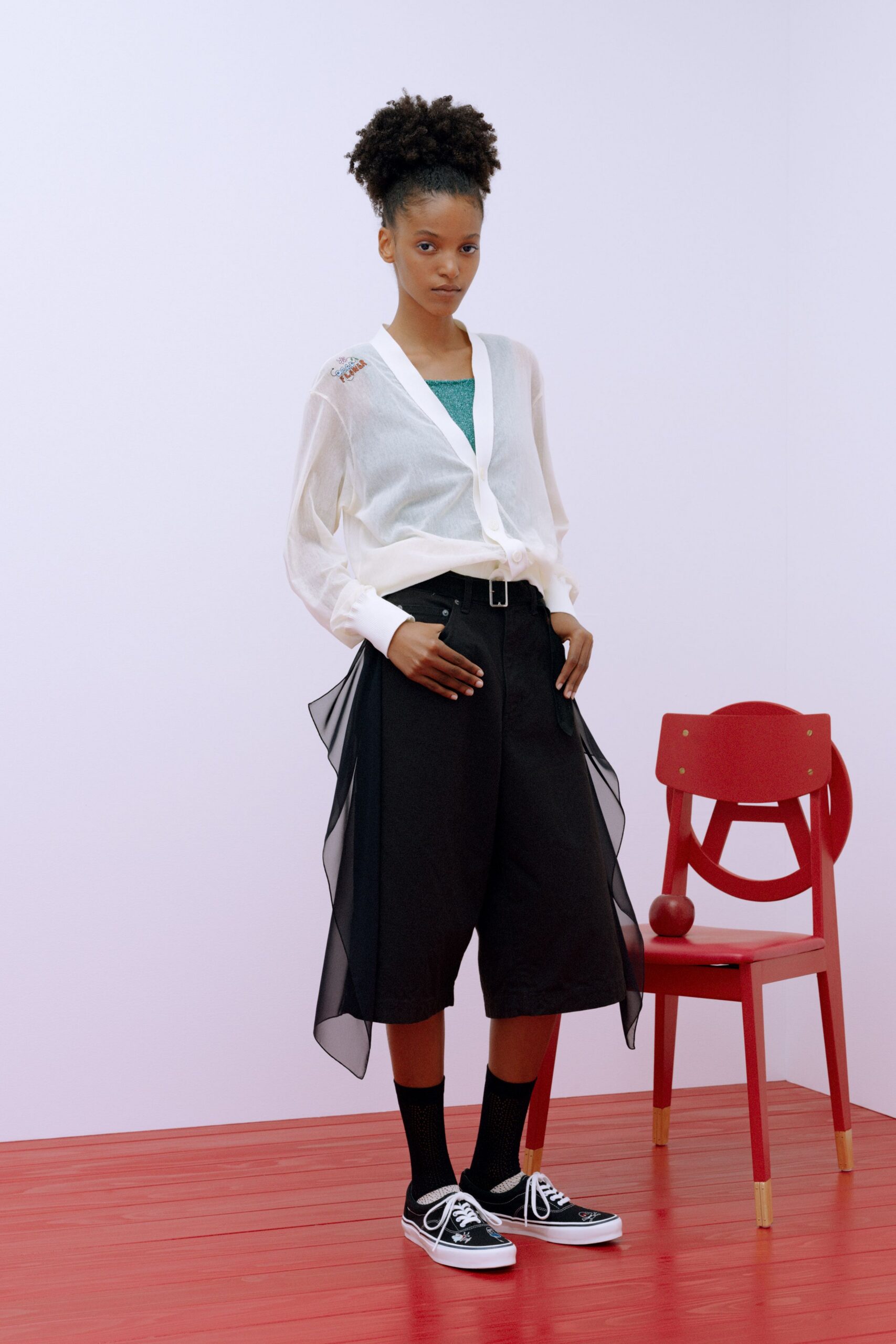 white relaxed shirt with black pants