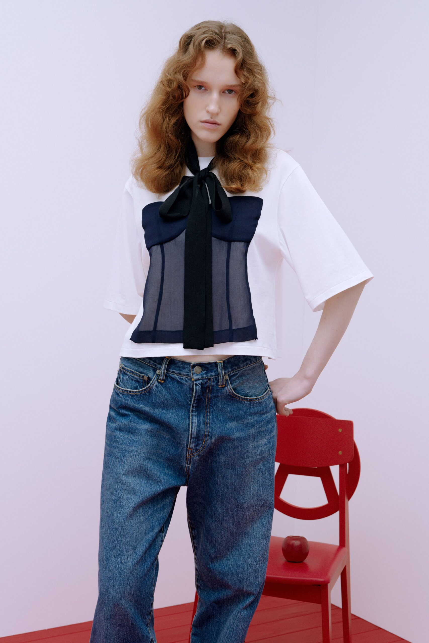 relaxed white and black top with blue jeans