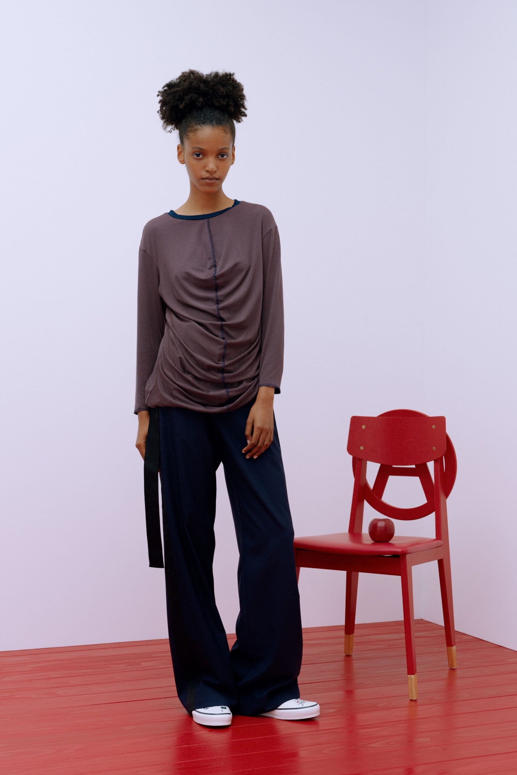 brown fitted top with navy pants