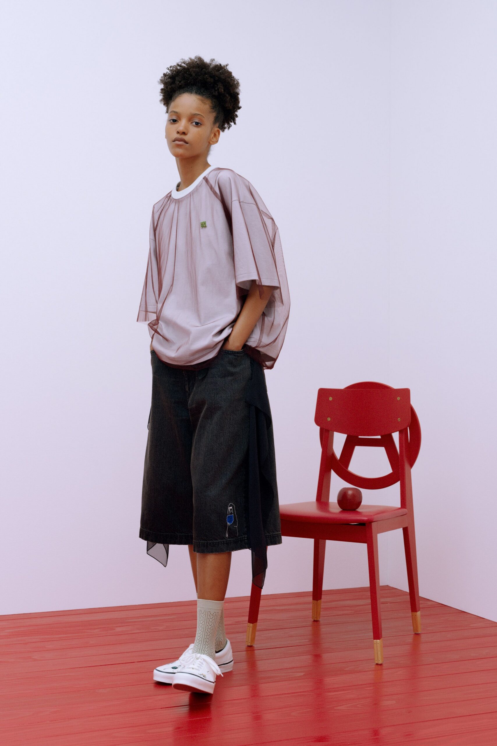 pink relaxed top with black wide-leg pants
