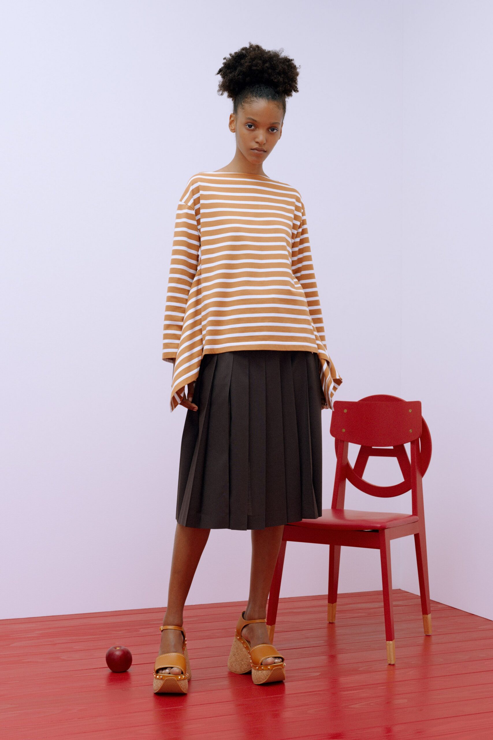 striped top black pleated skirt