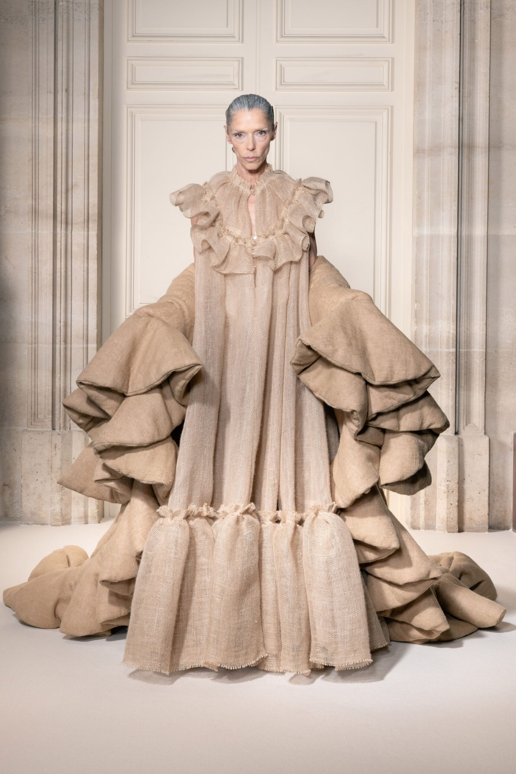 beige ruffled sleeveless gown