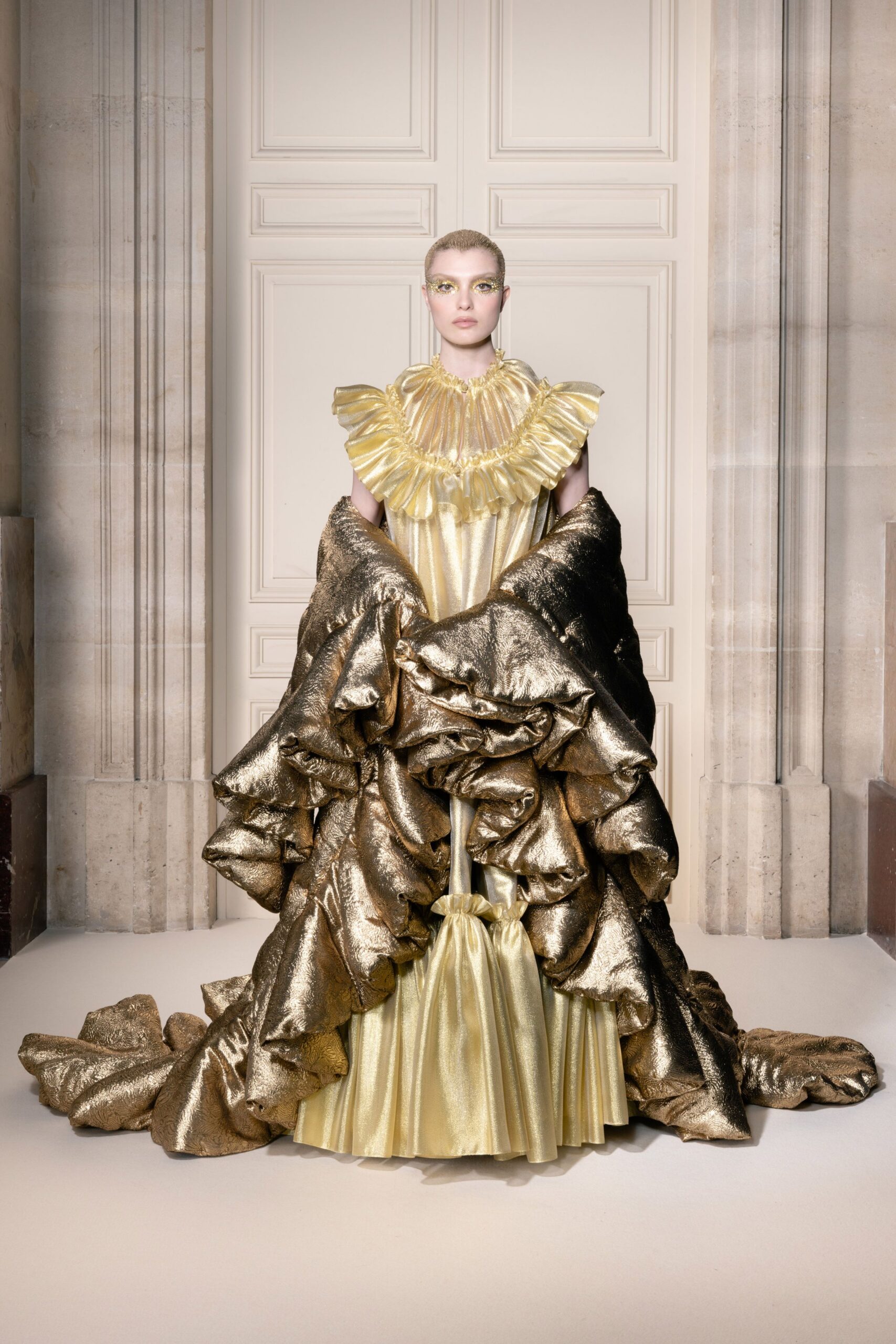 gold silk ruffled gown with cape