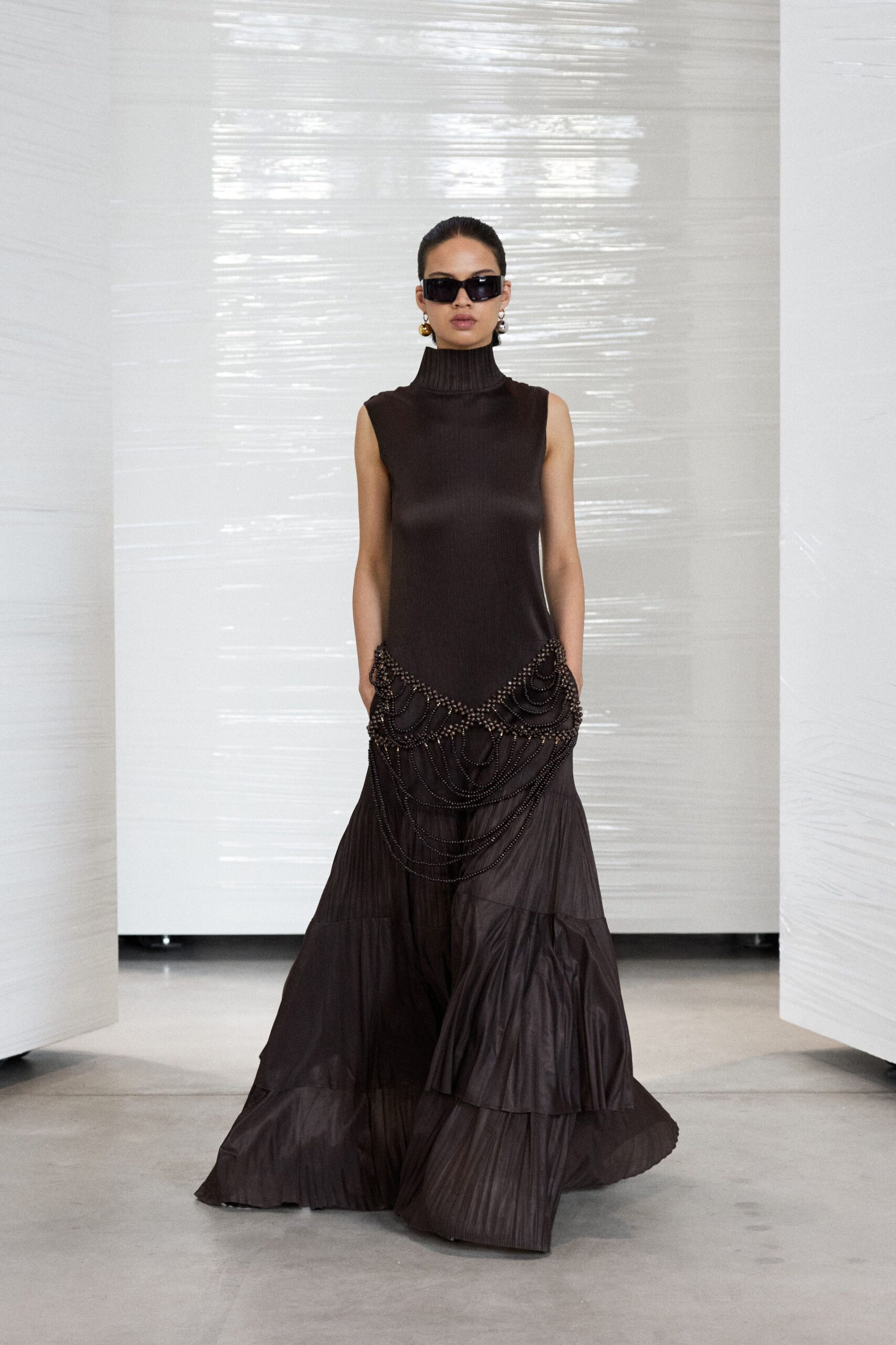 brown silk sleeveless high-neck fitted pleated tiered gown