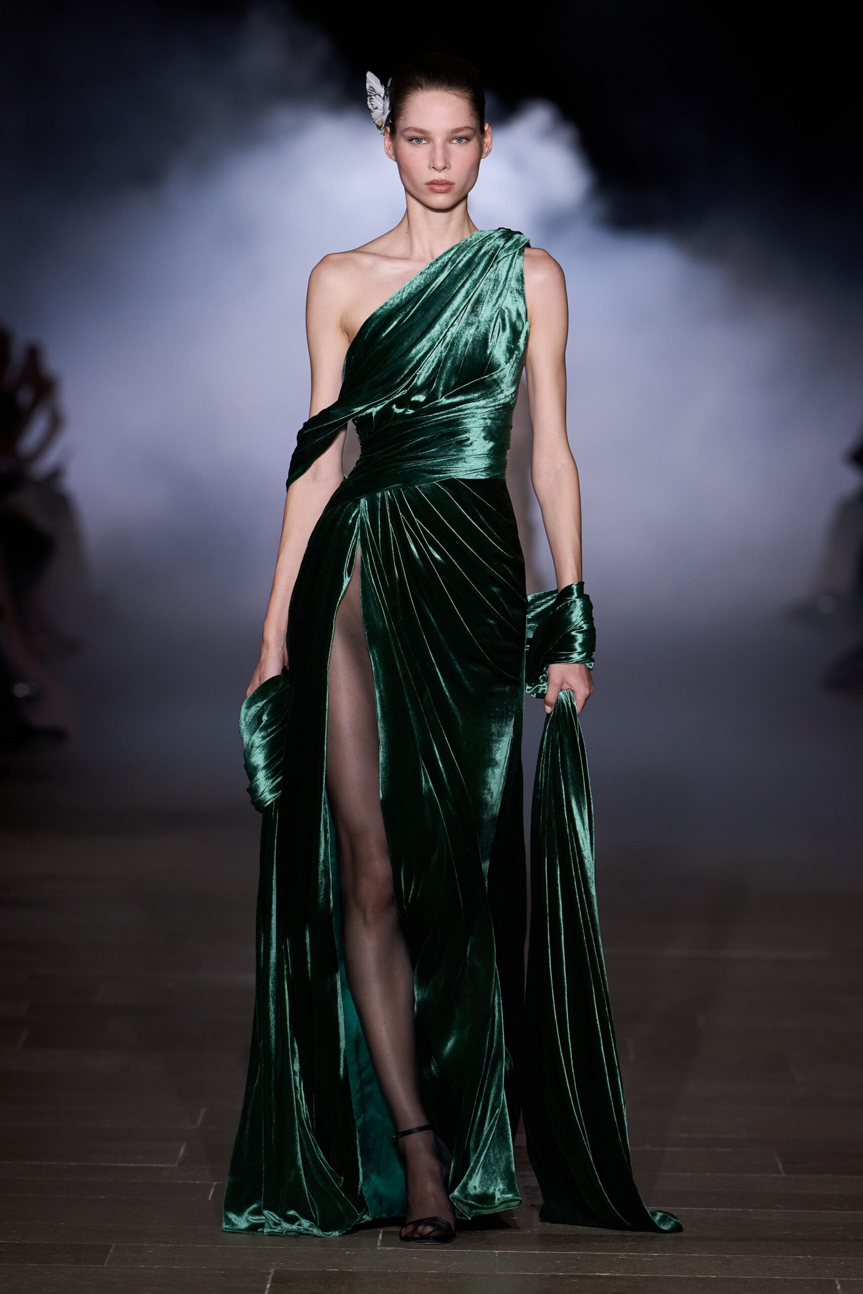green velvet sleeveless high-neck fitted pleated draped gown