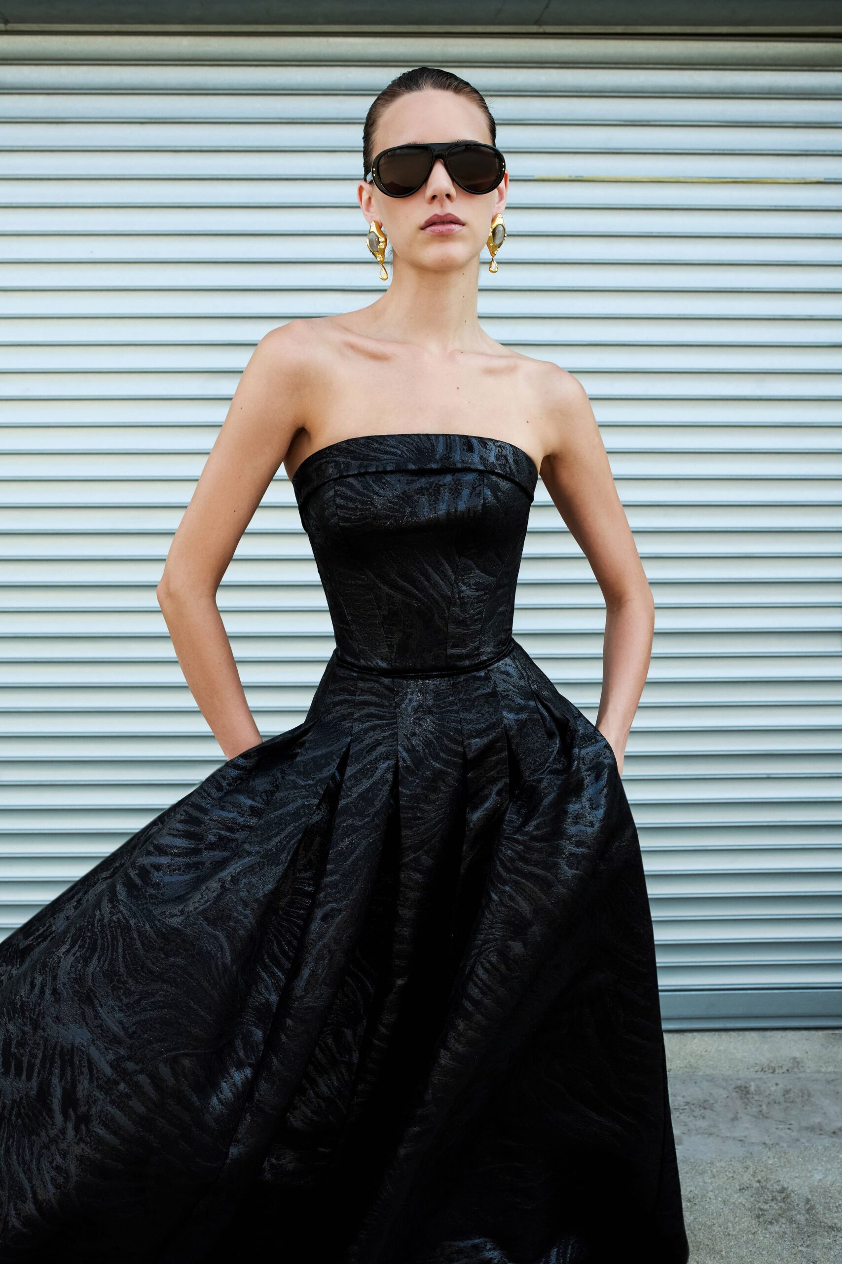 black silk strapless fitted pleated a-line maxi gown