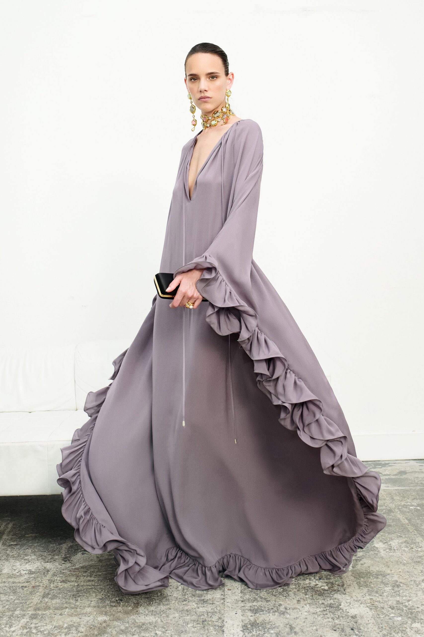 purple silk long-sleeve v-neck fitted ruffled flowing gown