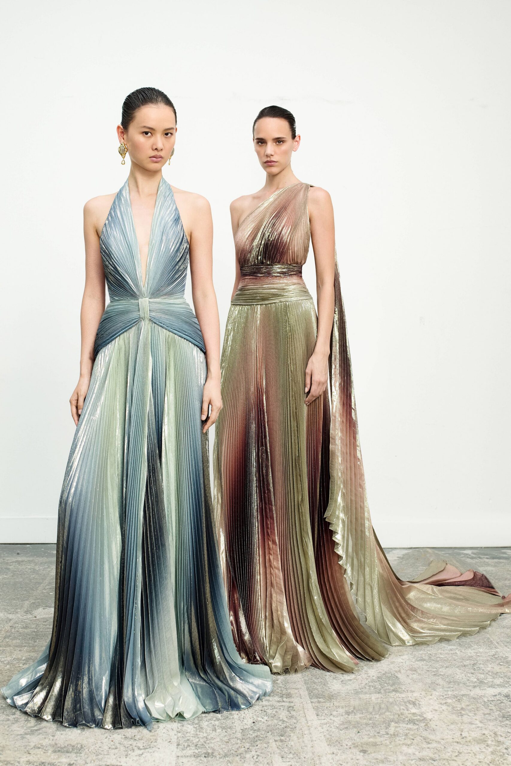 blue silk sleeveless v-neck fitted pleated flowing gown