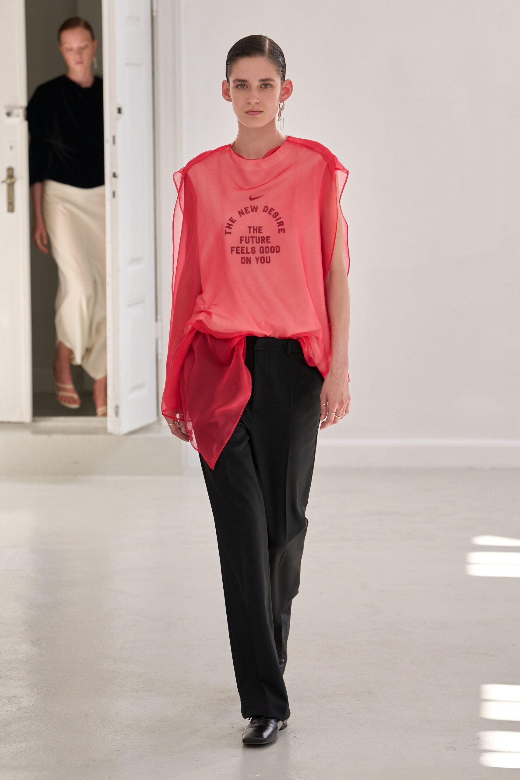 pink relaxed top with printed text