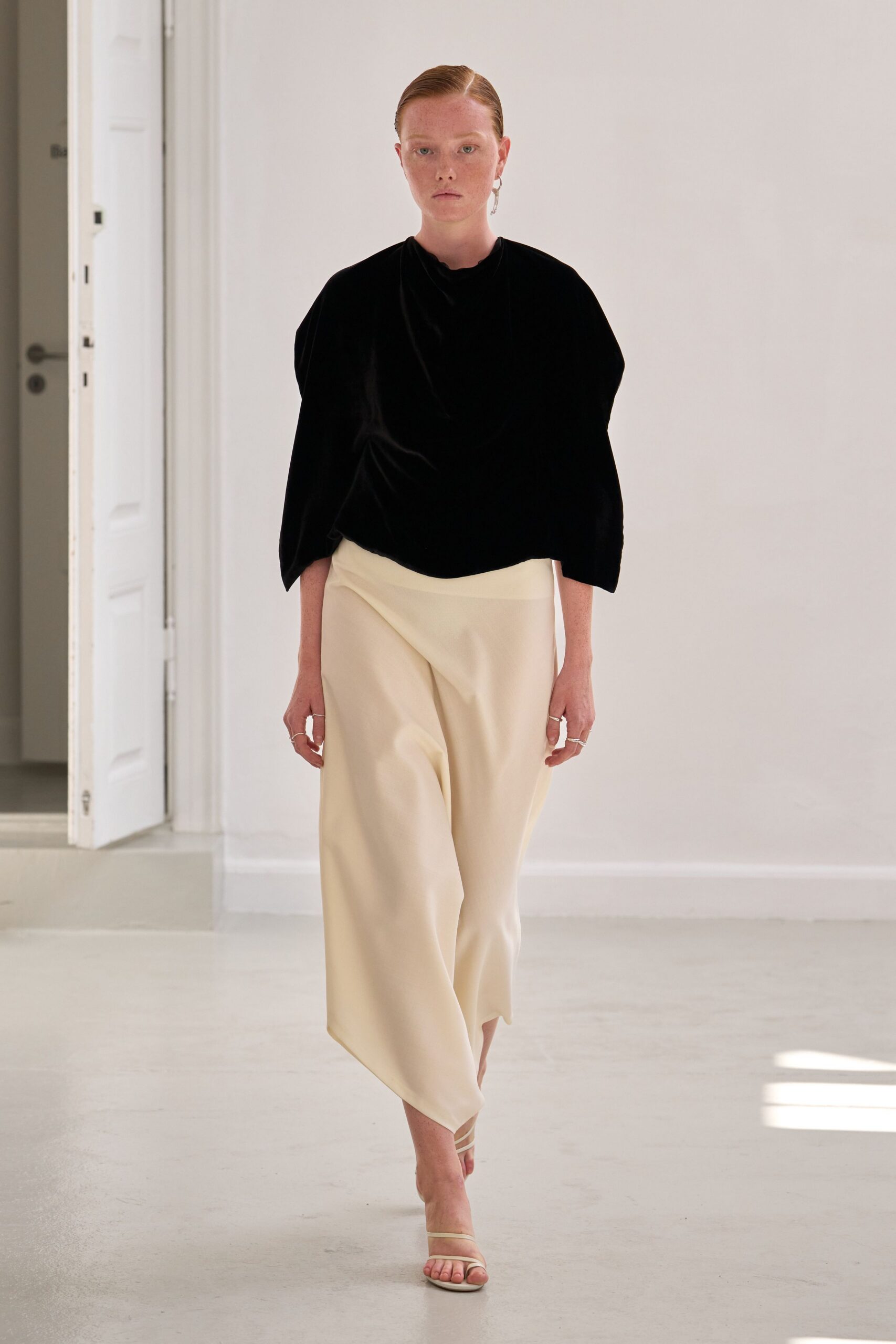 black velvet top white asymmetric pants
