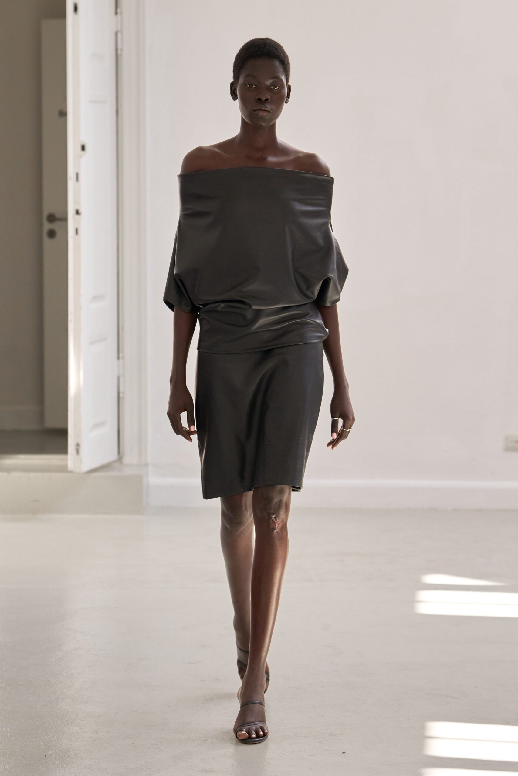 black leather off-shoulder dress