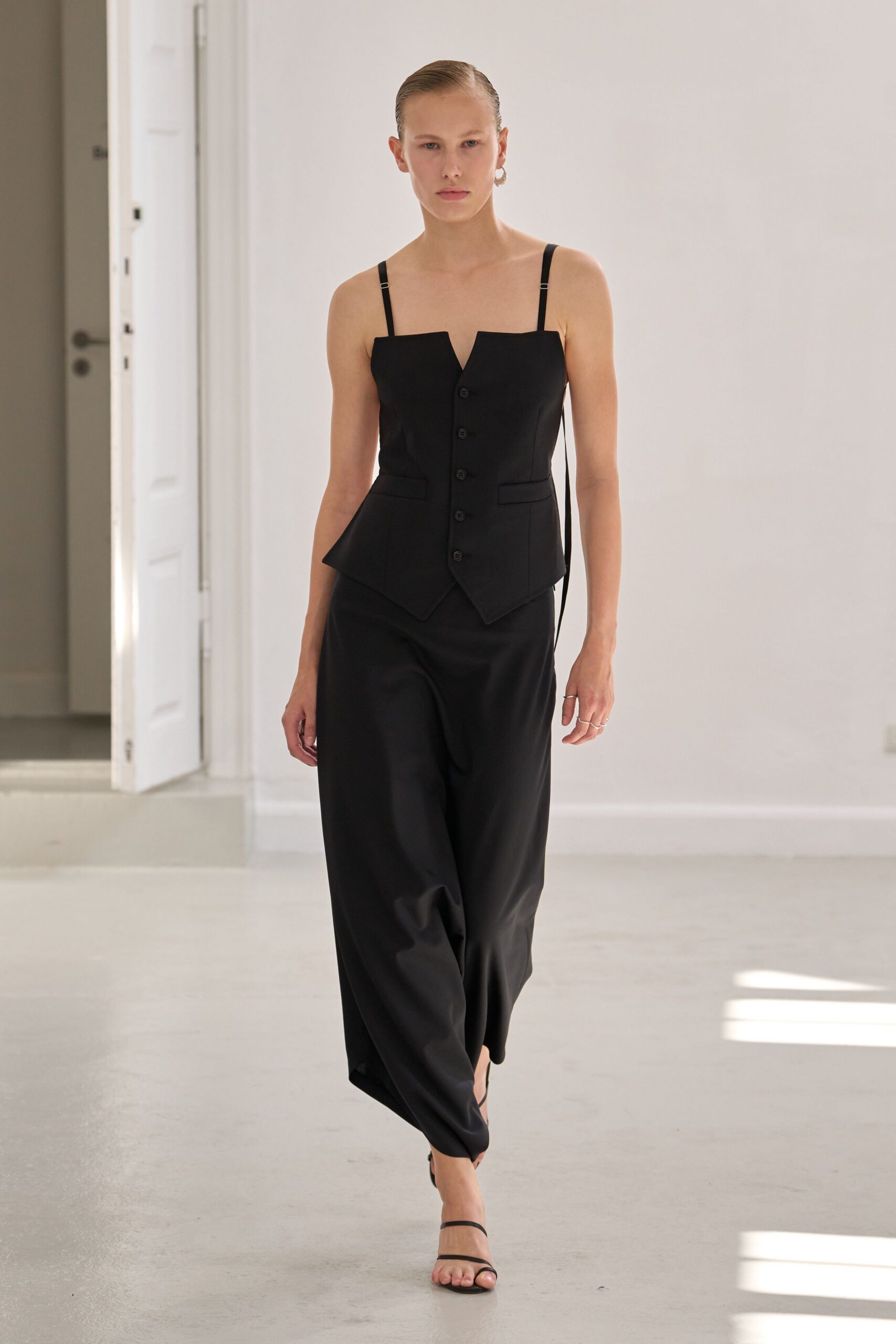 black fitted top and relaxed pants