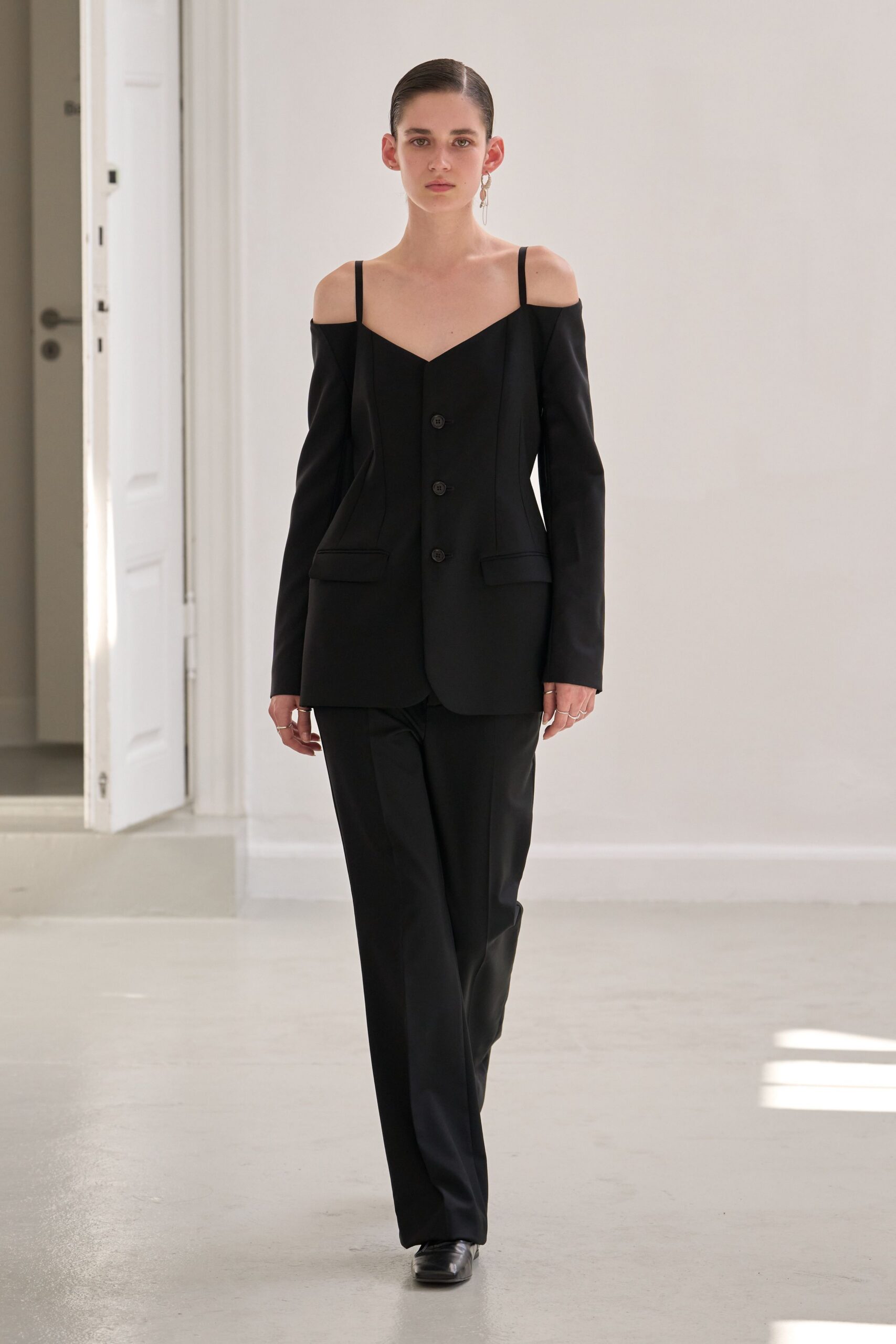 black off-shoulder blazer with tailored pants