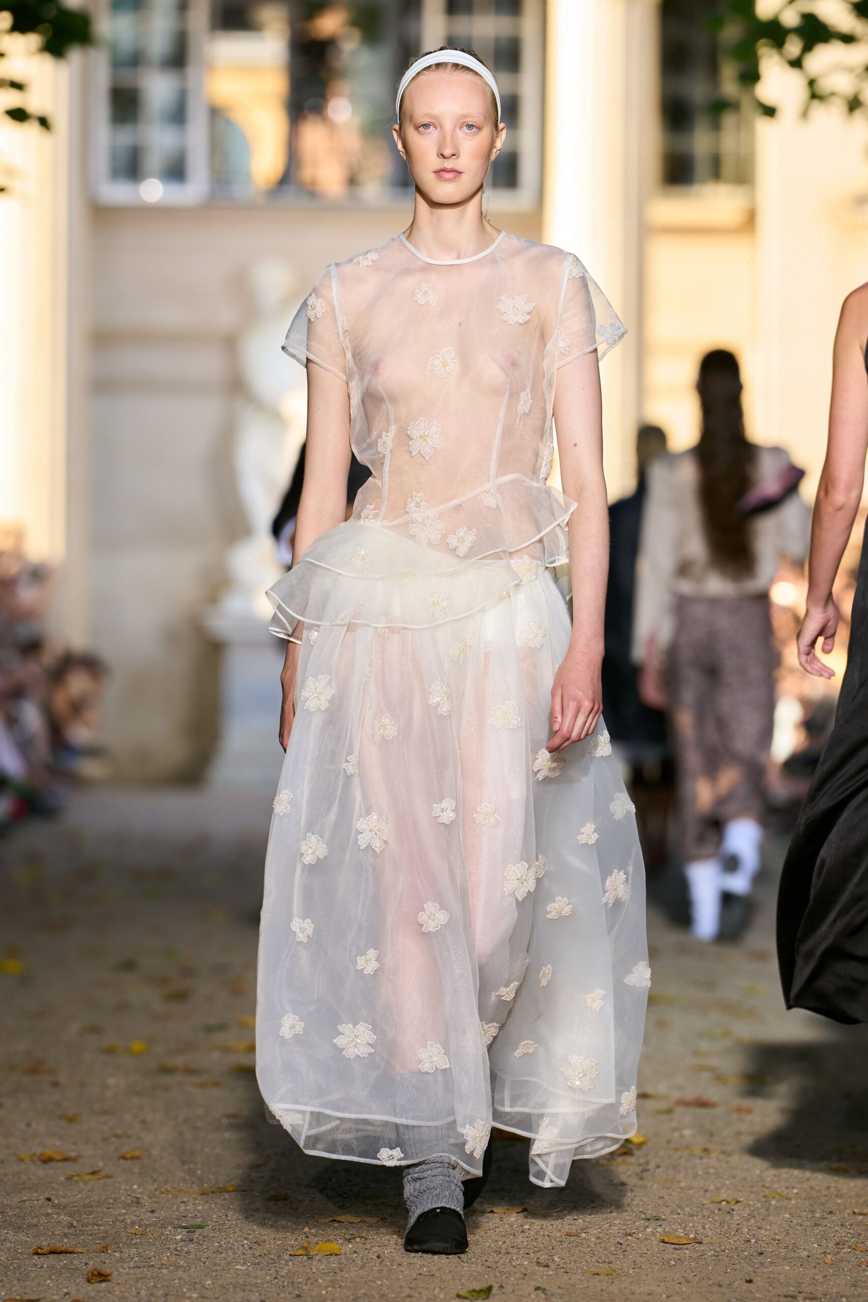 white tulle sleeveless high-neck fitted layered embroidered gown