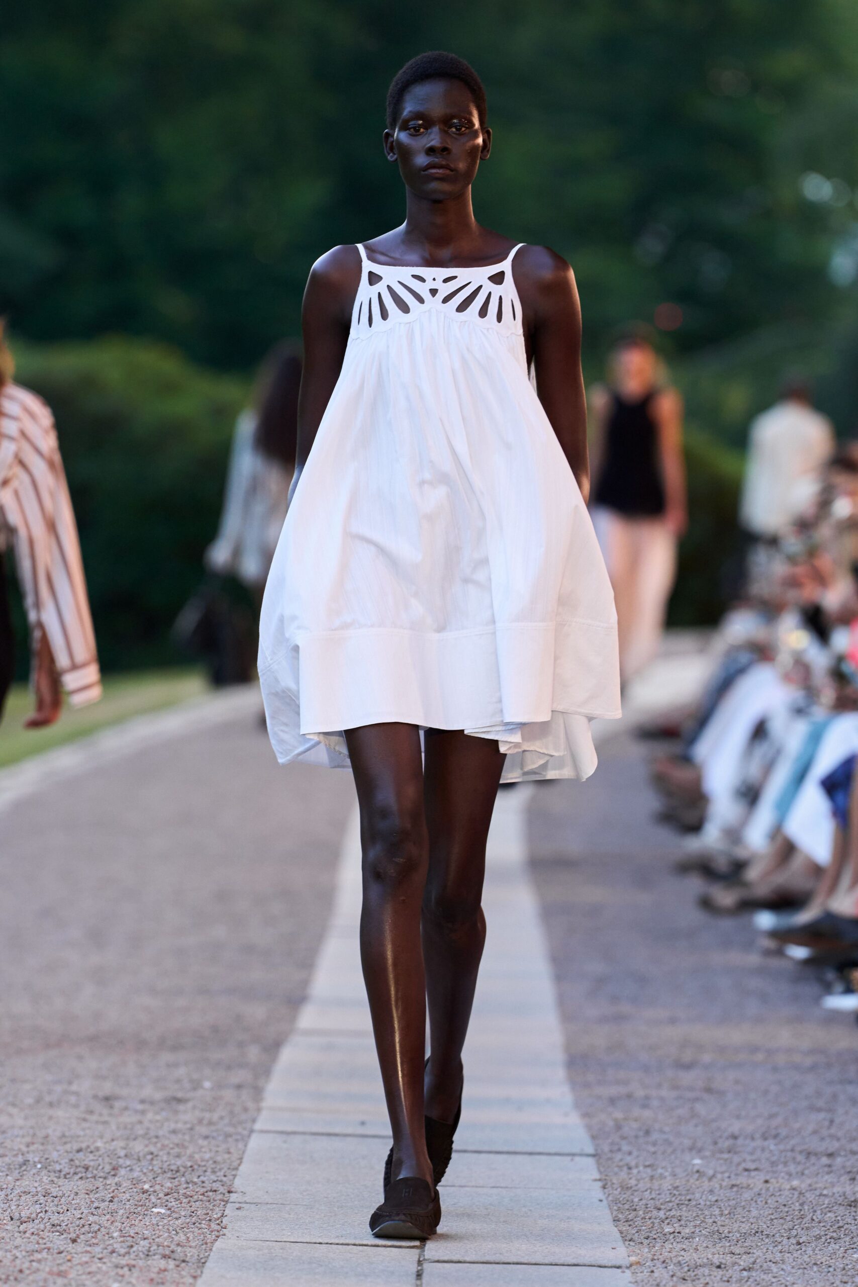 white cotton sleeveless high-neck relaxed pleated mini dress