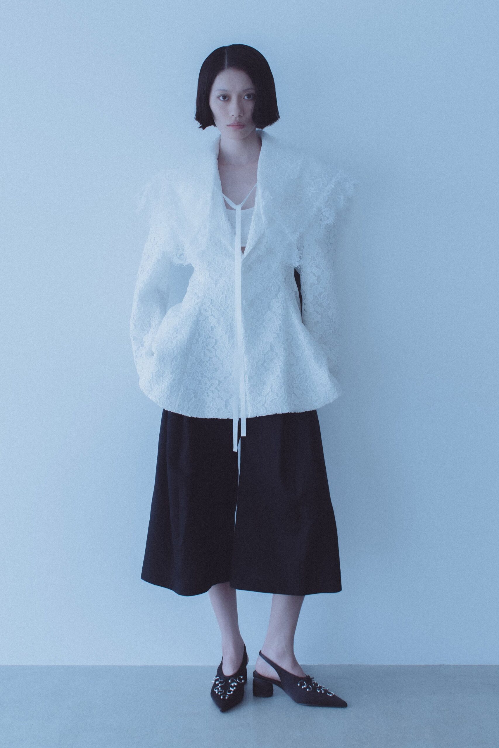 white lace relaxed jacket with black culottes