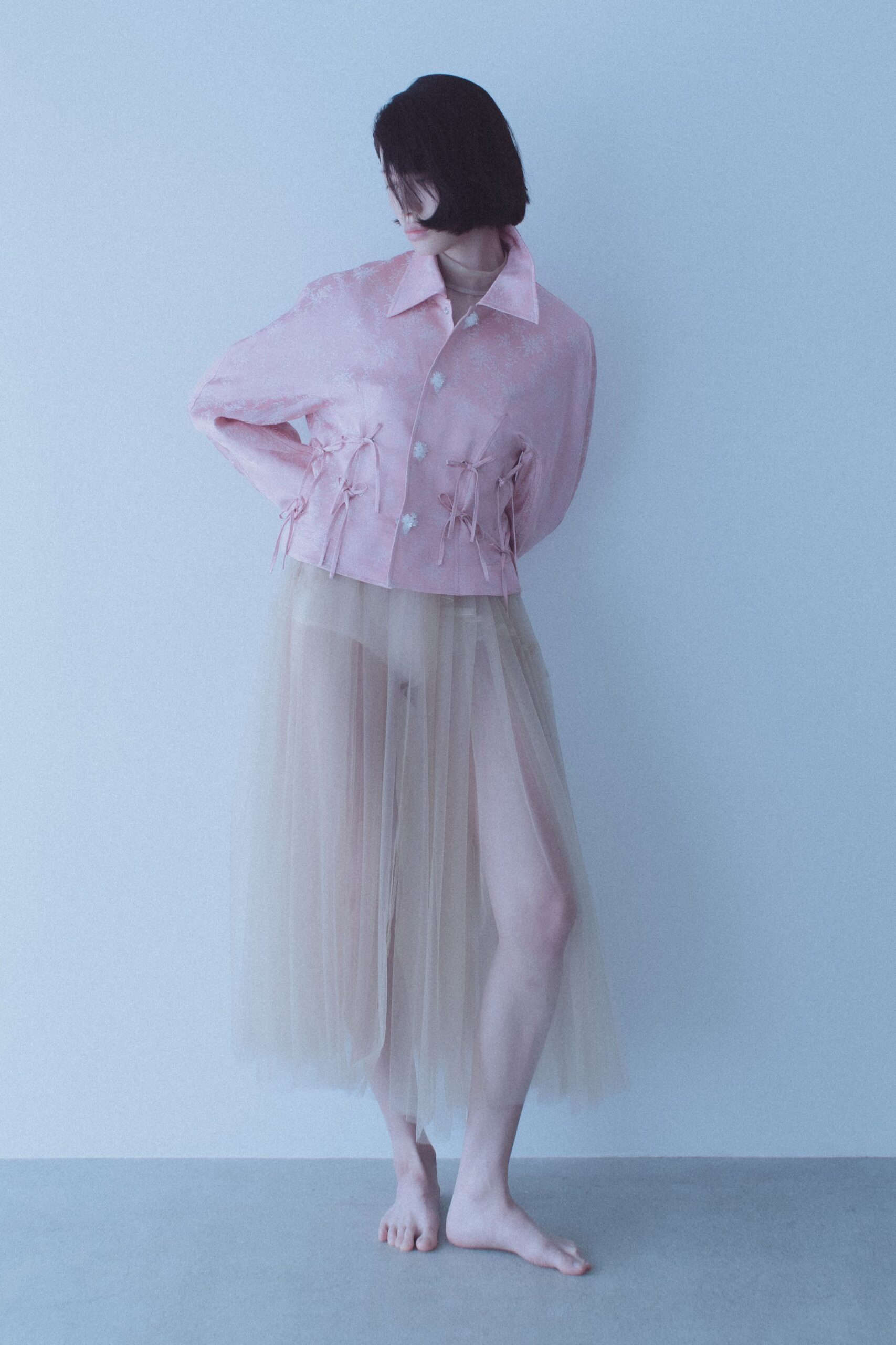pink silk jacket with beige tulle skirt