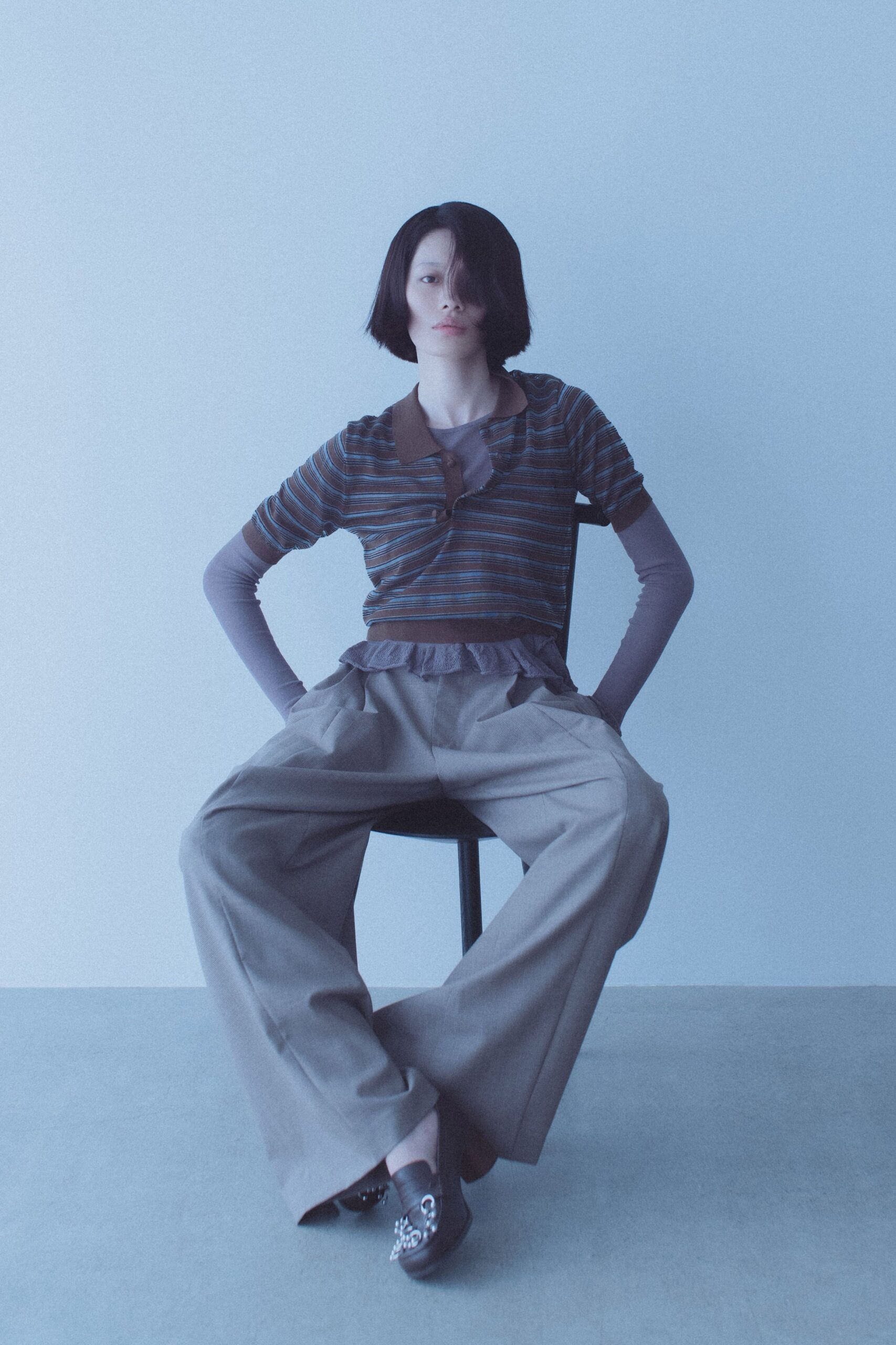 blue striped fitted top with beige pants