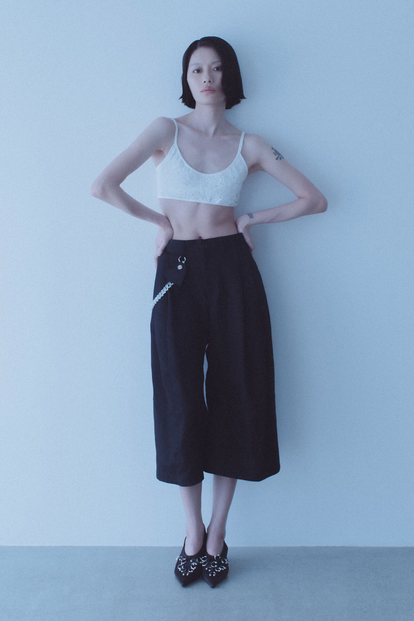 white lace crop-top black culottes