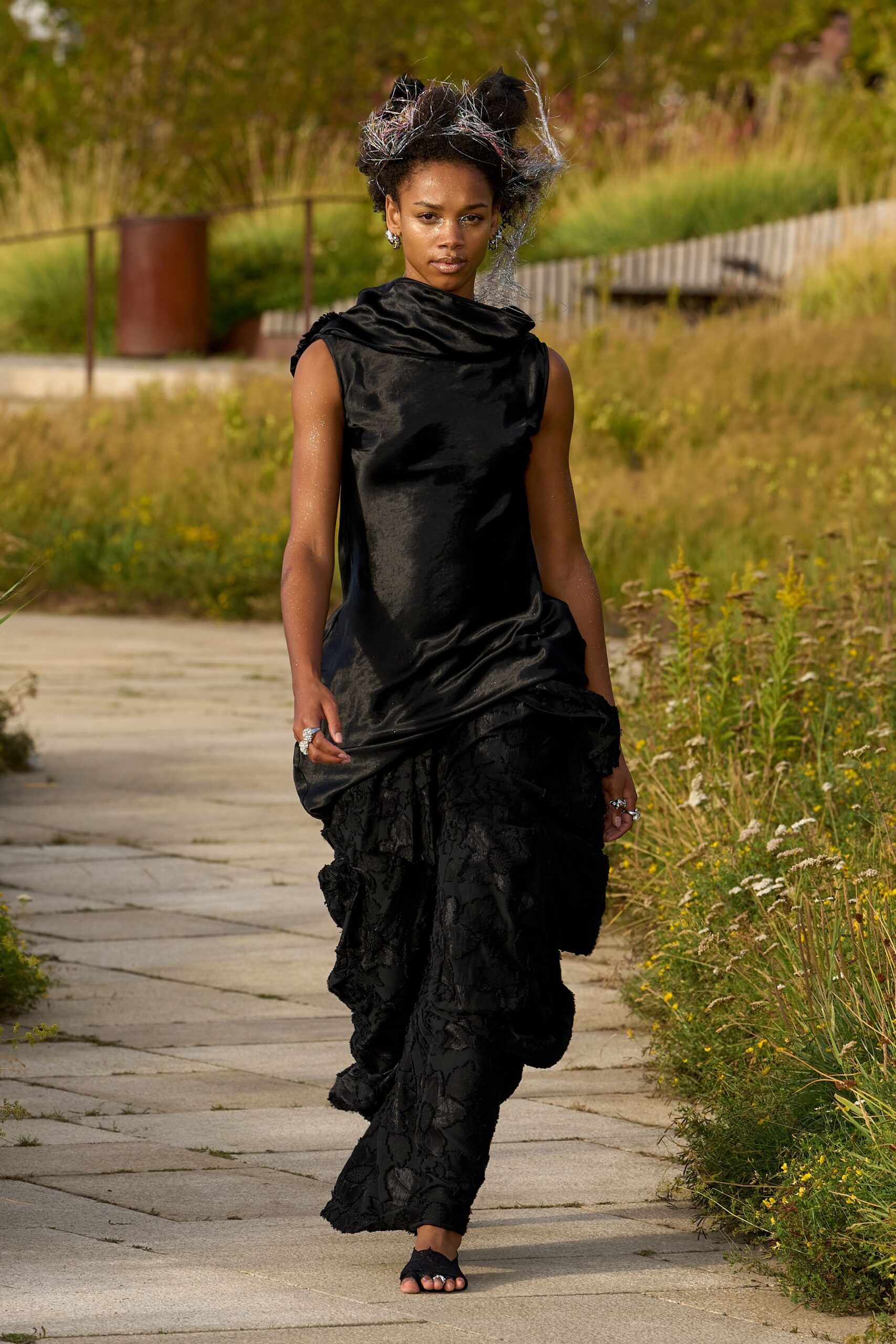 black silk sleeveless high-neck fitted draped top