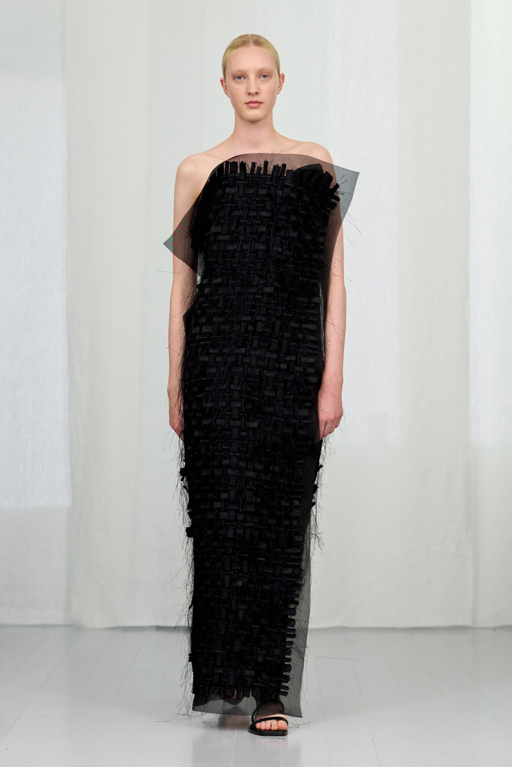 black silk strapless fitted layered fringed flowing gown