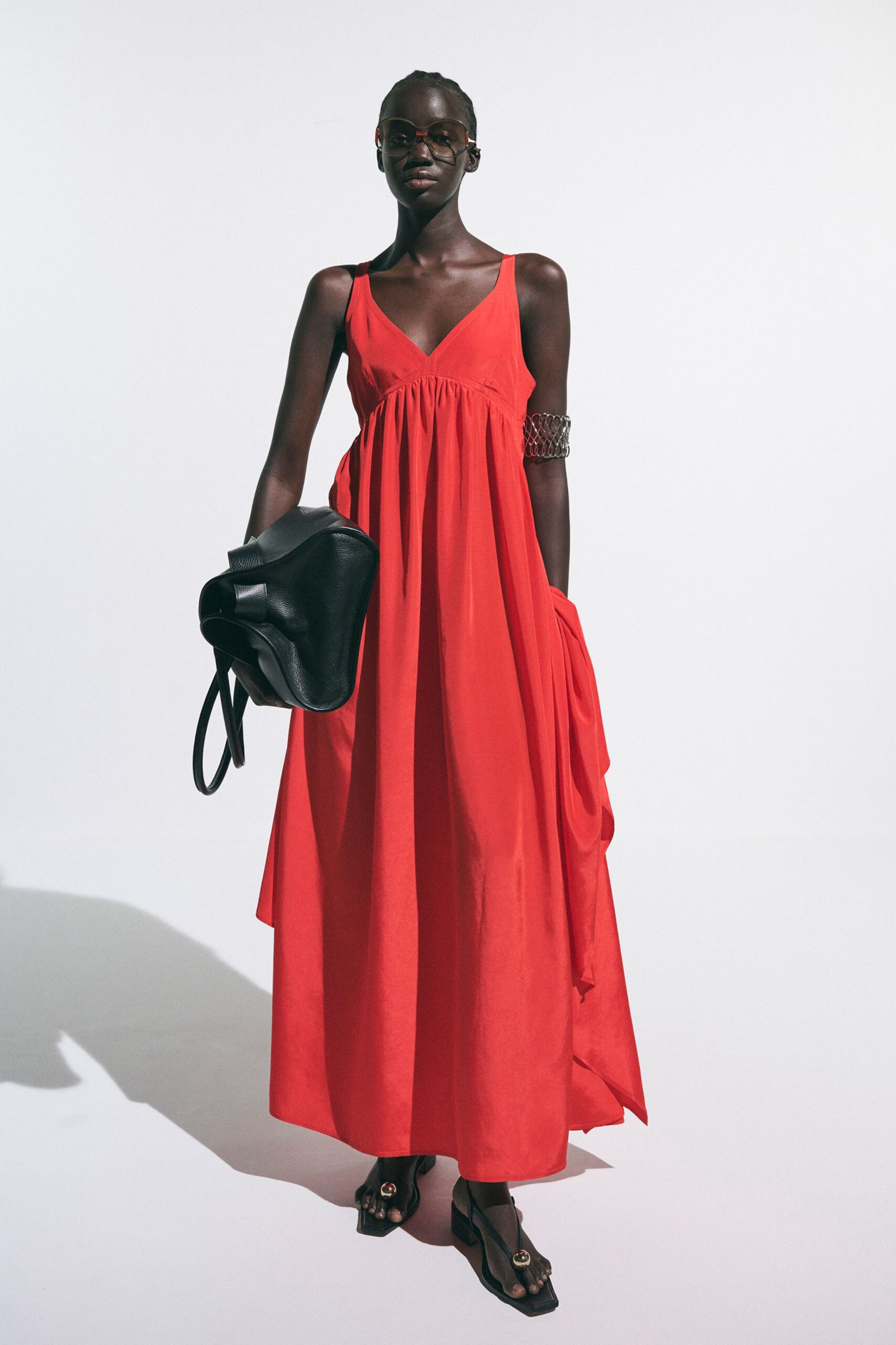 red cotton sleeveless v-neck relaxed pleated maxi gown