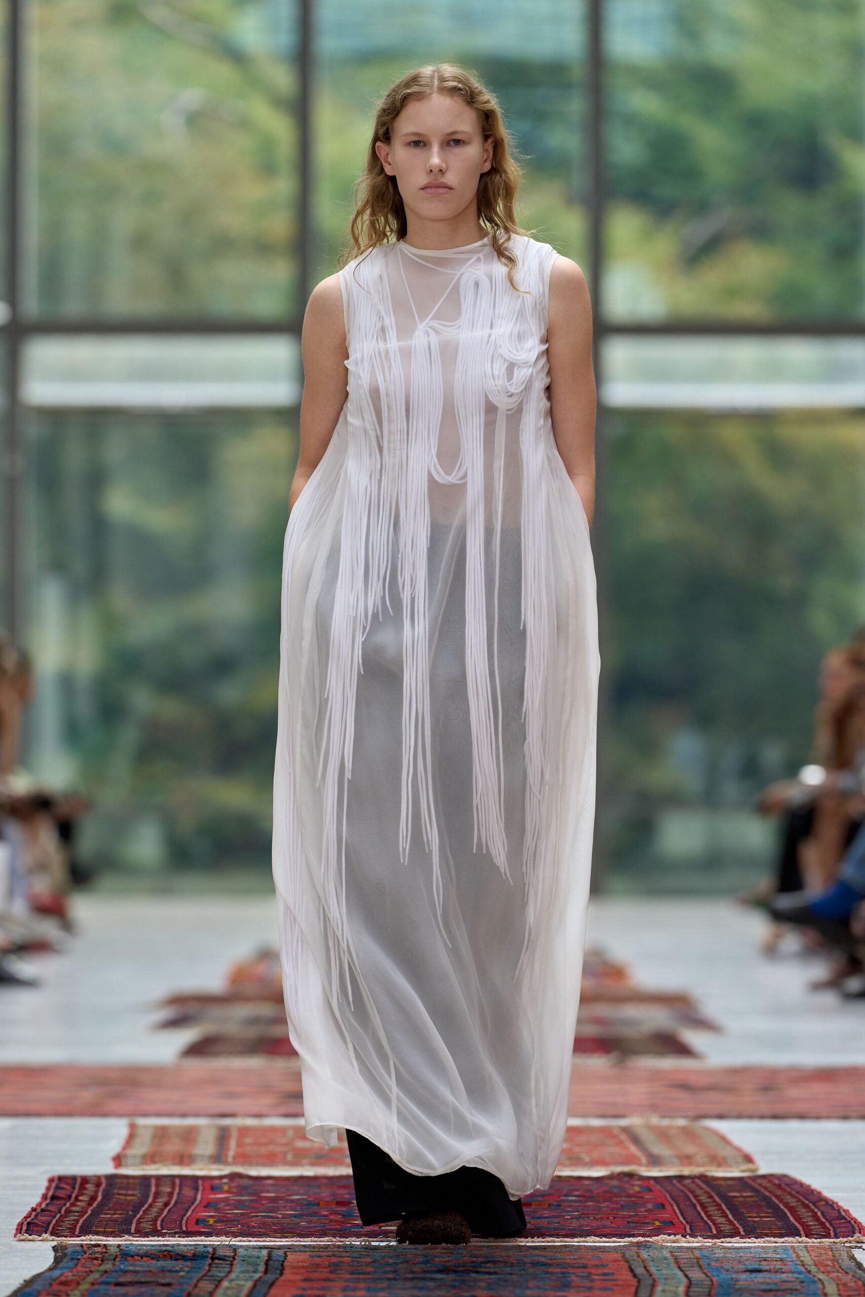 white sheer sleeveless gown
