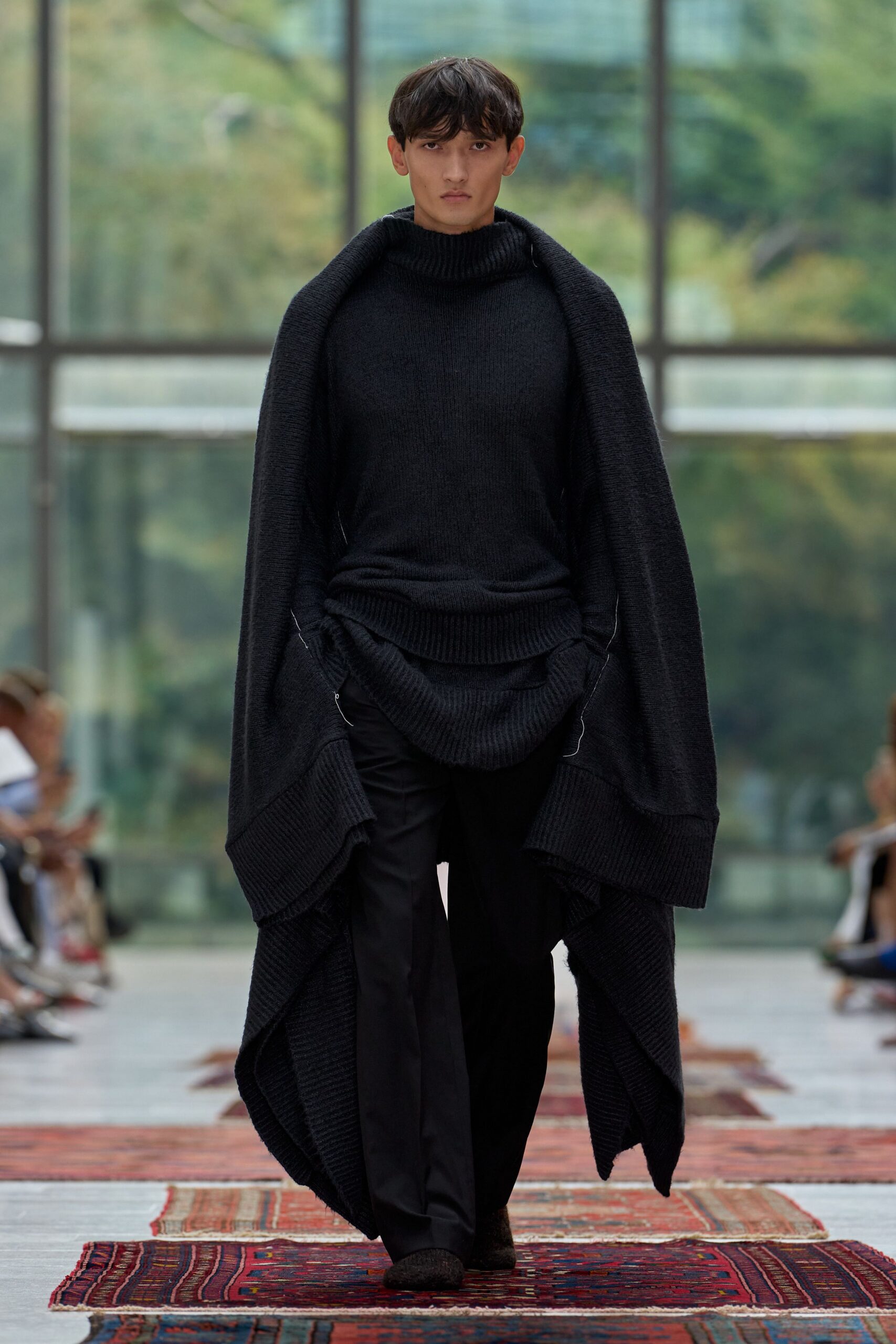 black wool long-sleeve high-neck oversized draped sweater