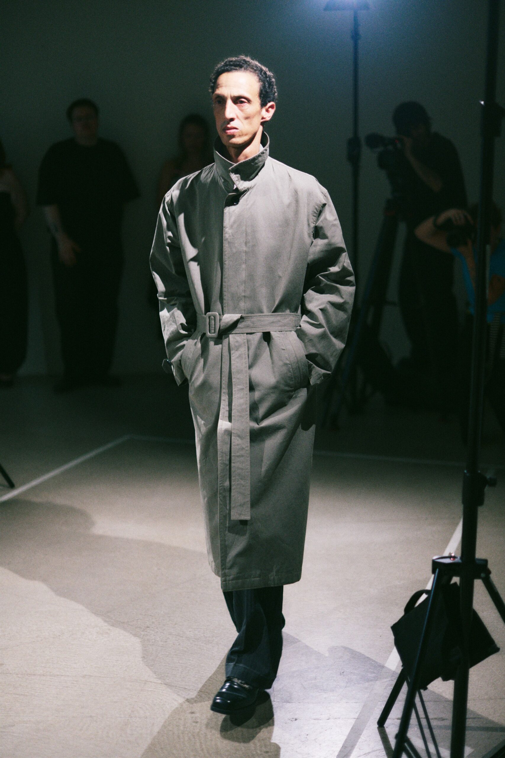 gray belted coat with black pants