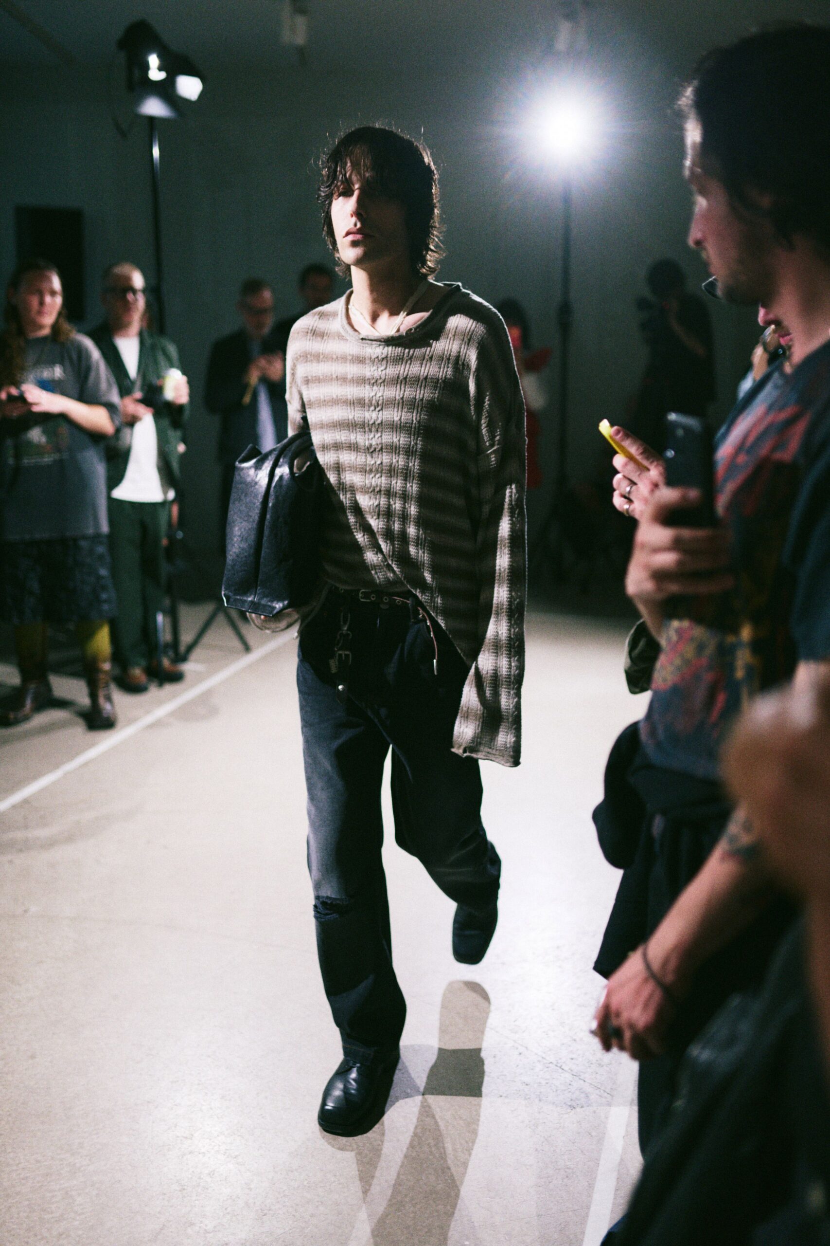 gray striped relaxed sweater with black pants