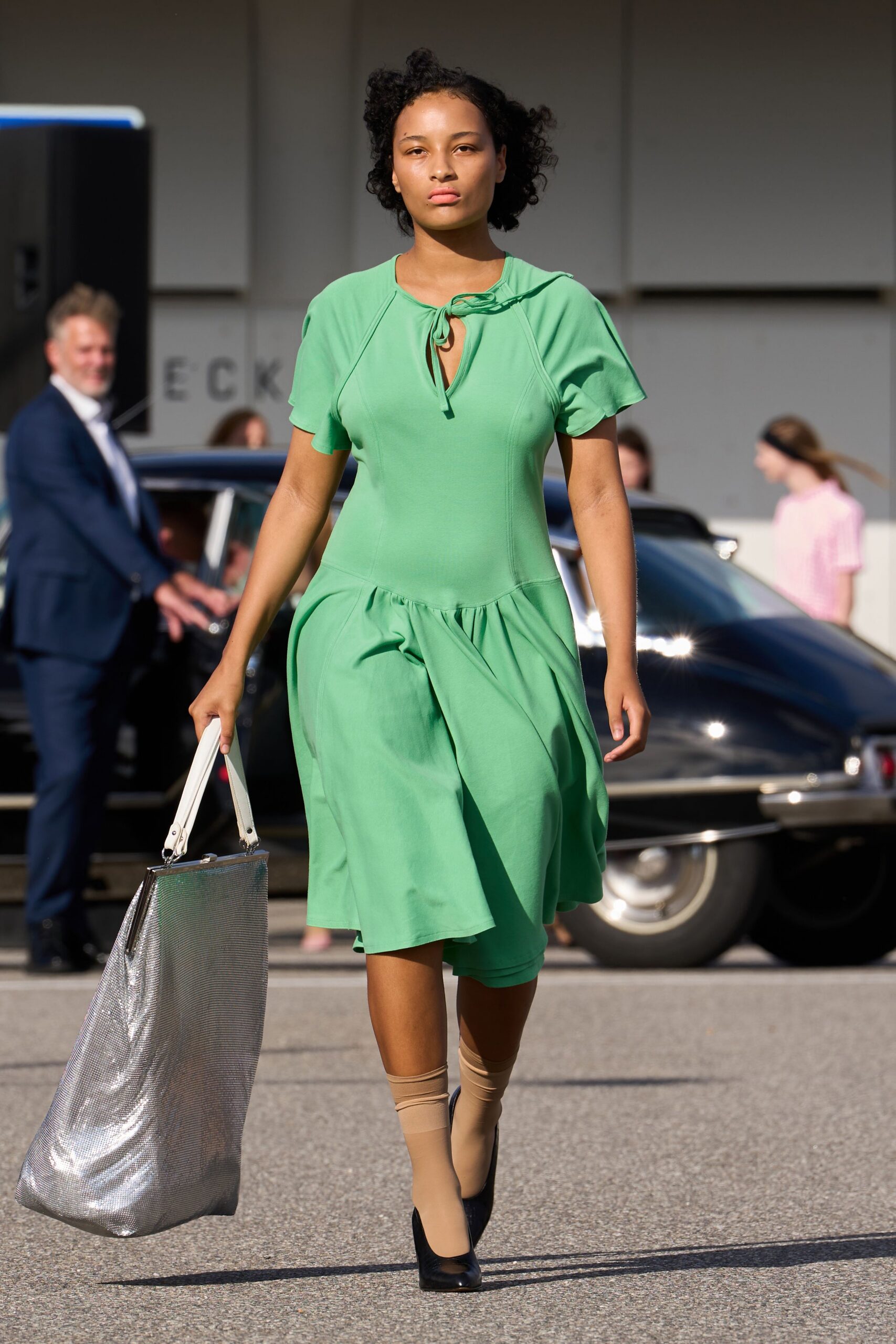 green cotton short-sleeve v-neck fitted pleated midi dress