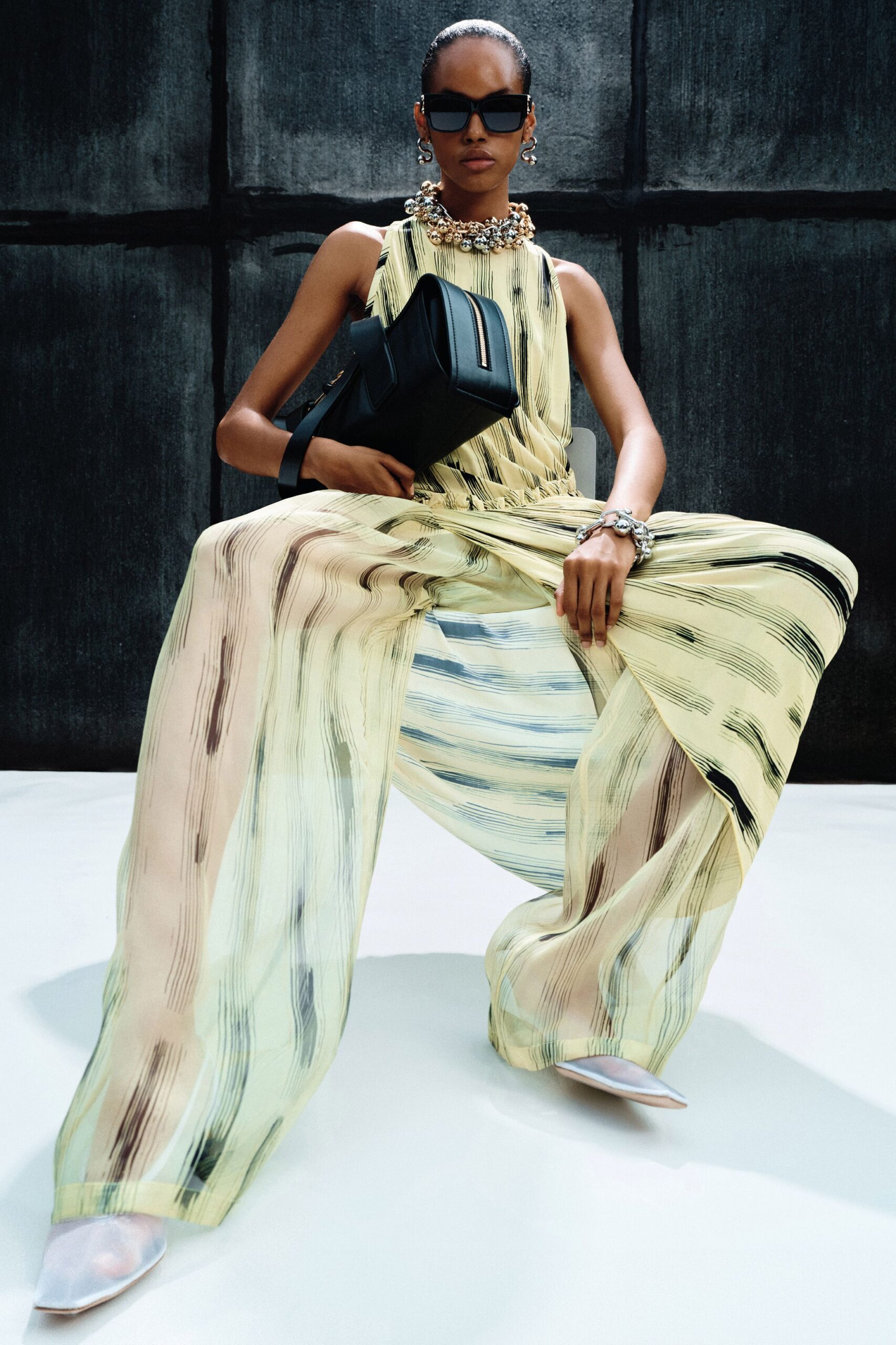 yellow silk sleeveless high-neck relaxed layered flowing jumpsuit