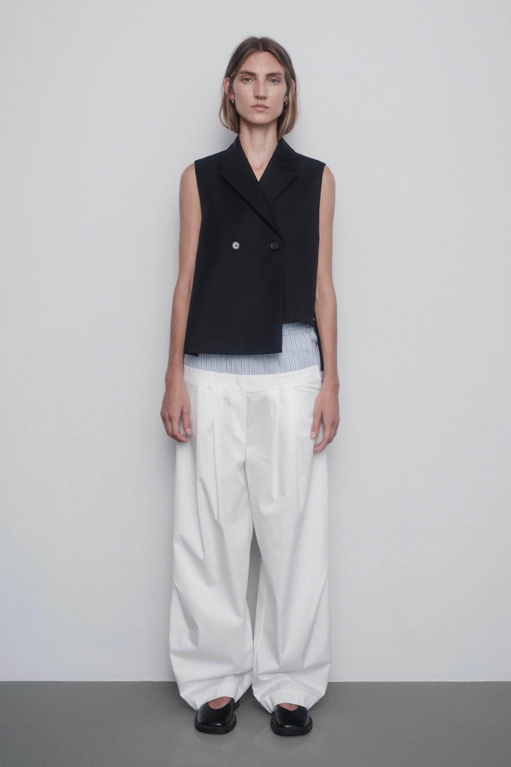 black cotton sleeveless collared structured buttoned vest