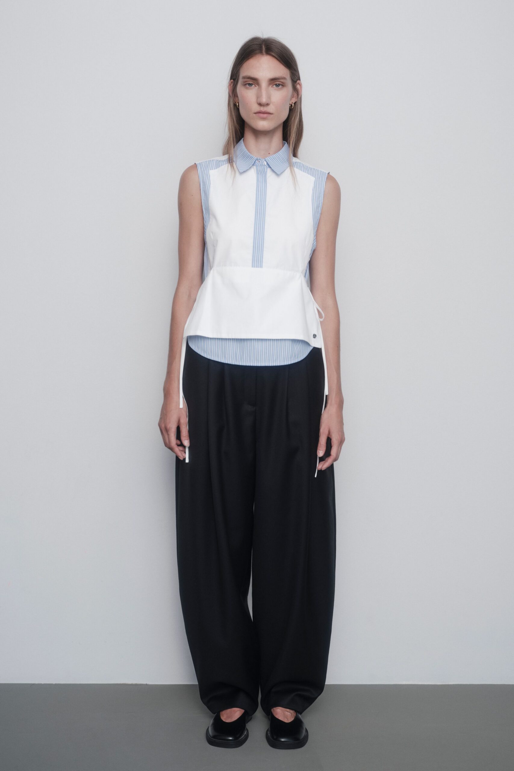 white cotton sleeveless collared fitted layered top