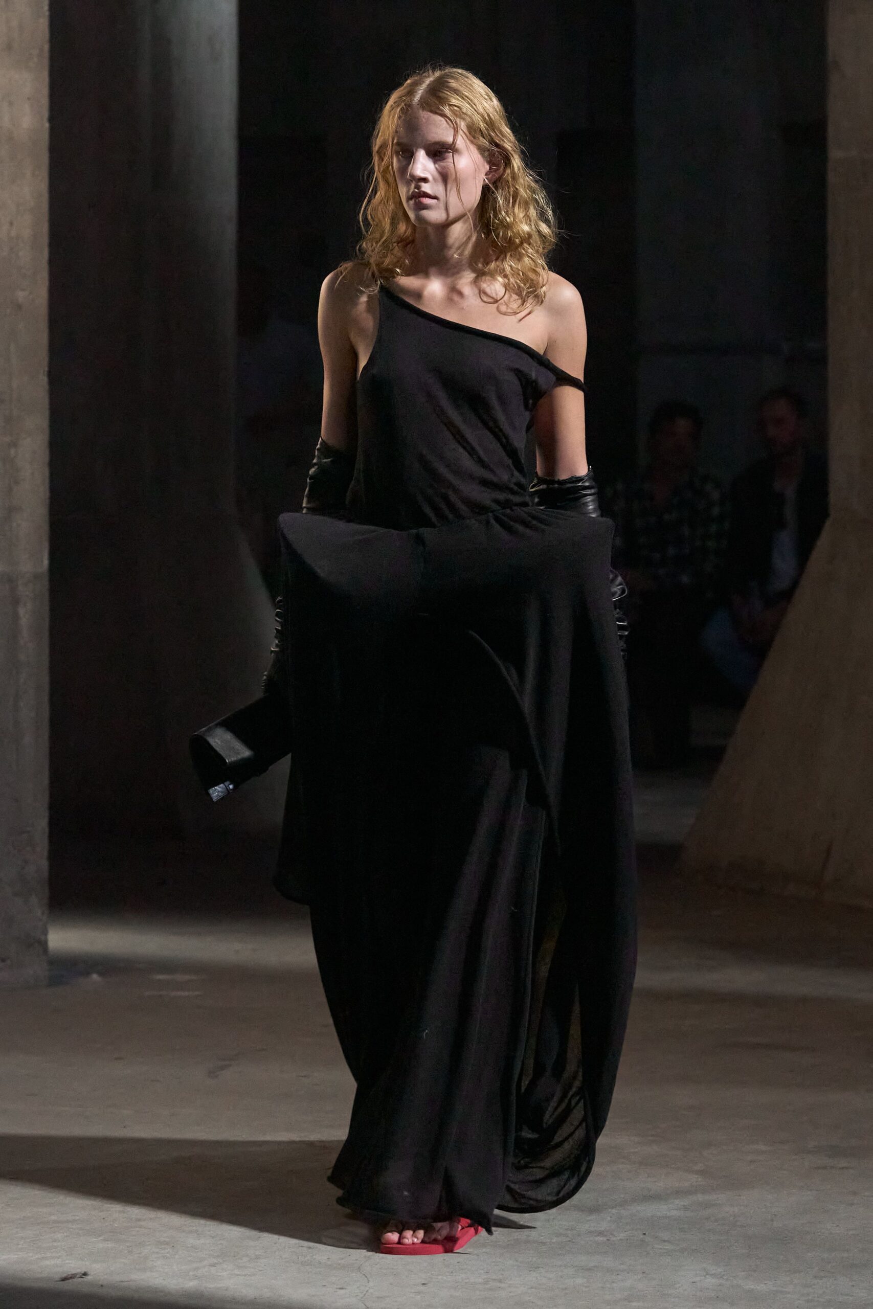 black silk sleeveless asymmetric fitted draped flowing gown