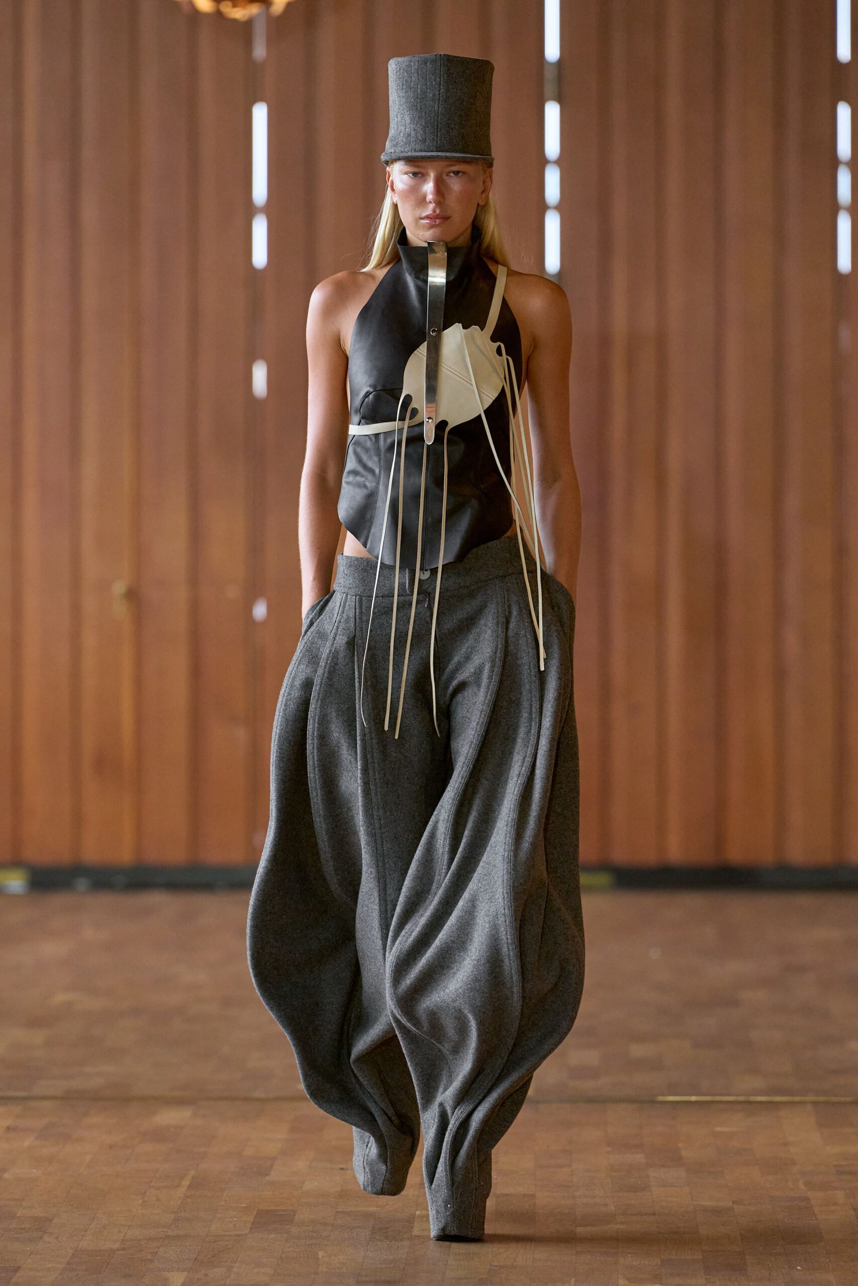 black leather sleeveless high-neck fitted draped top