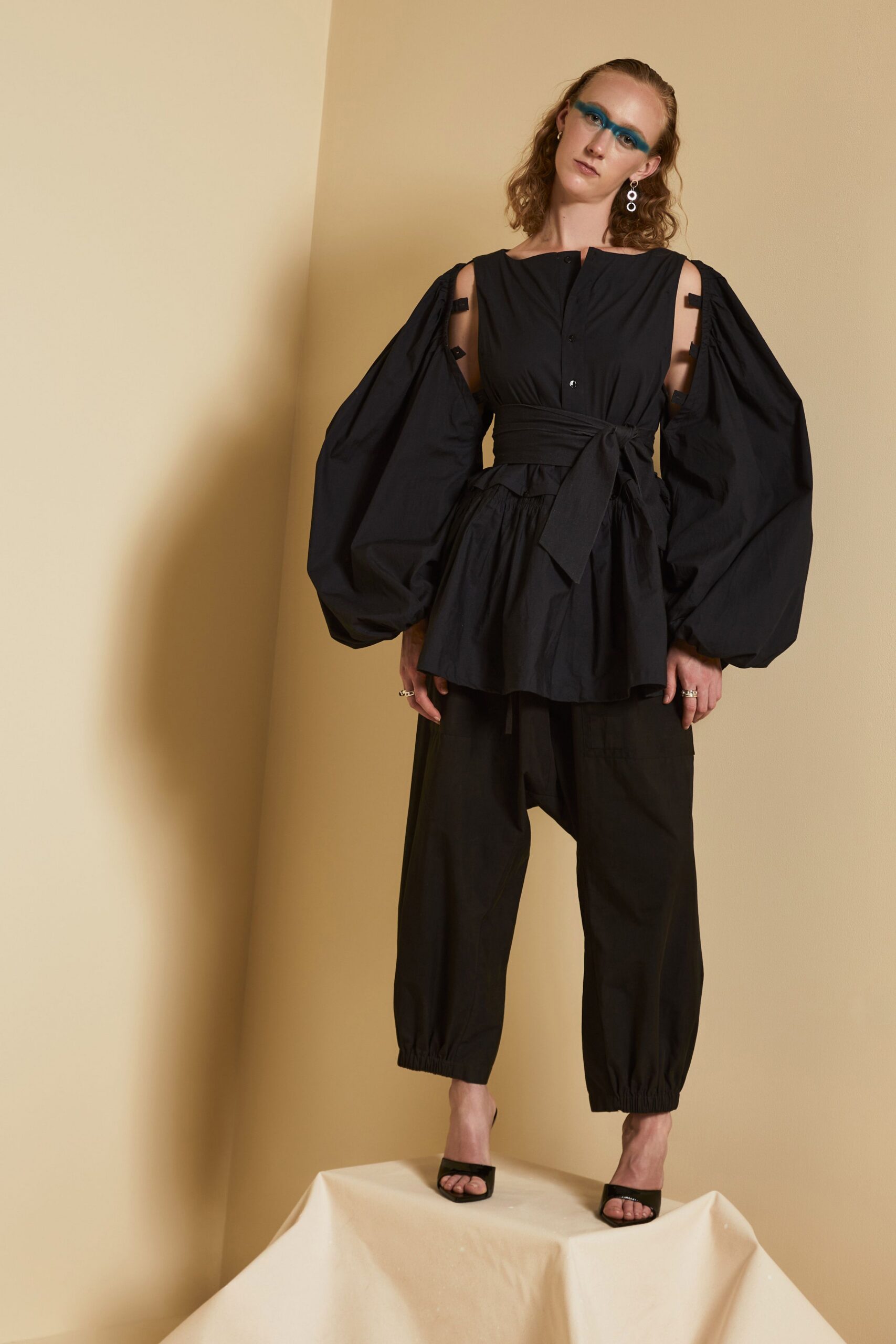 black cold-shoulder peplum top