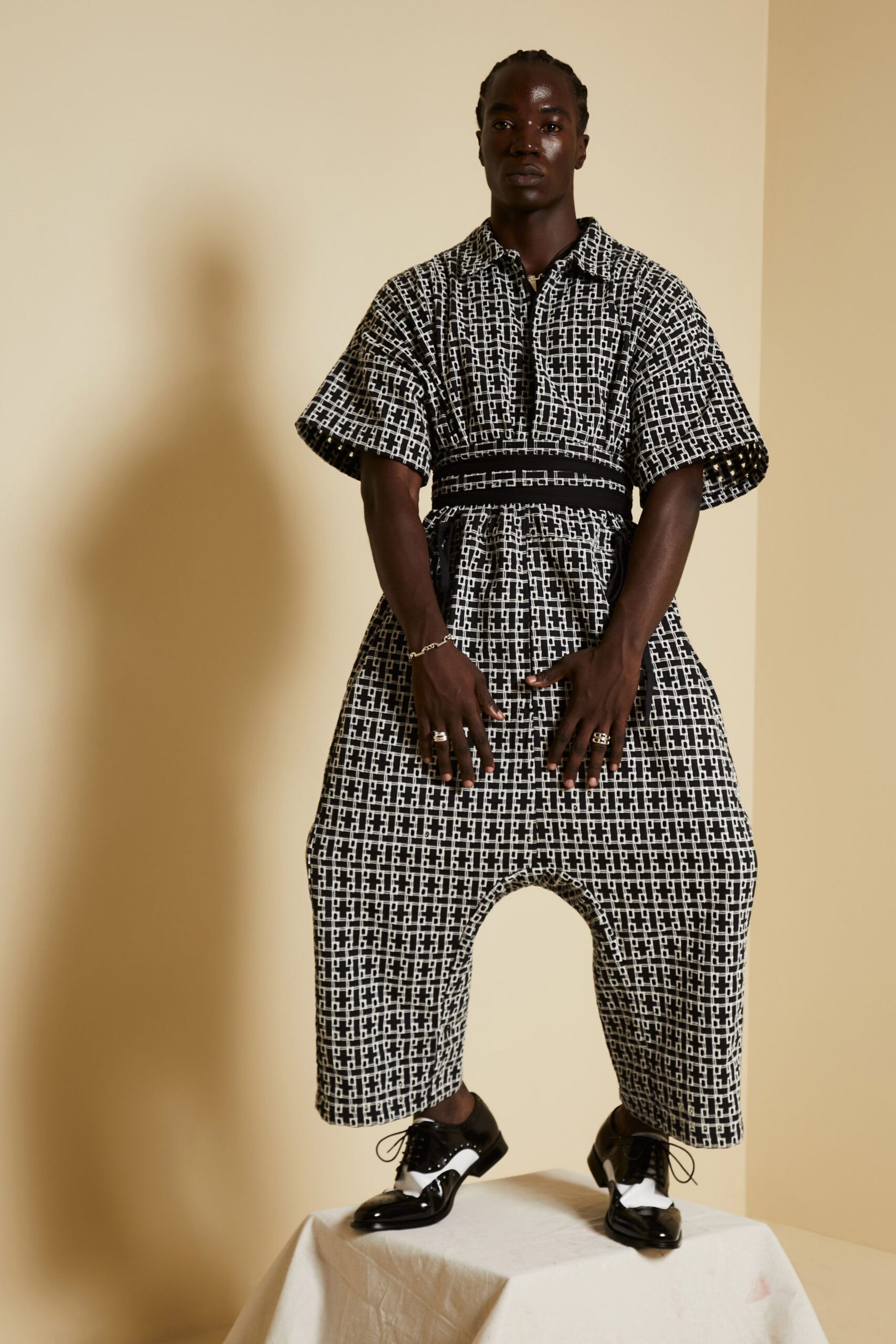 printed drop-crotch jumpsuit with waist sash