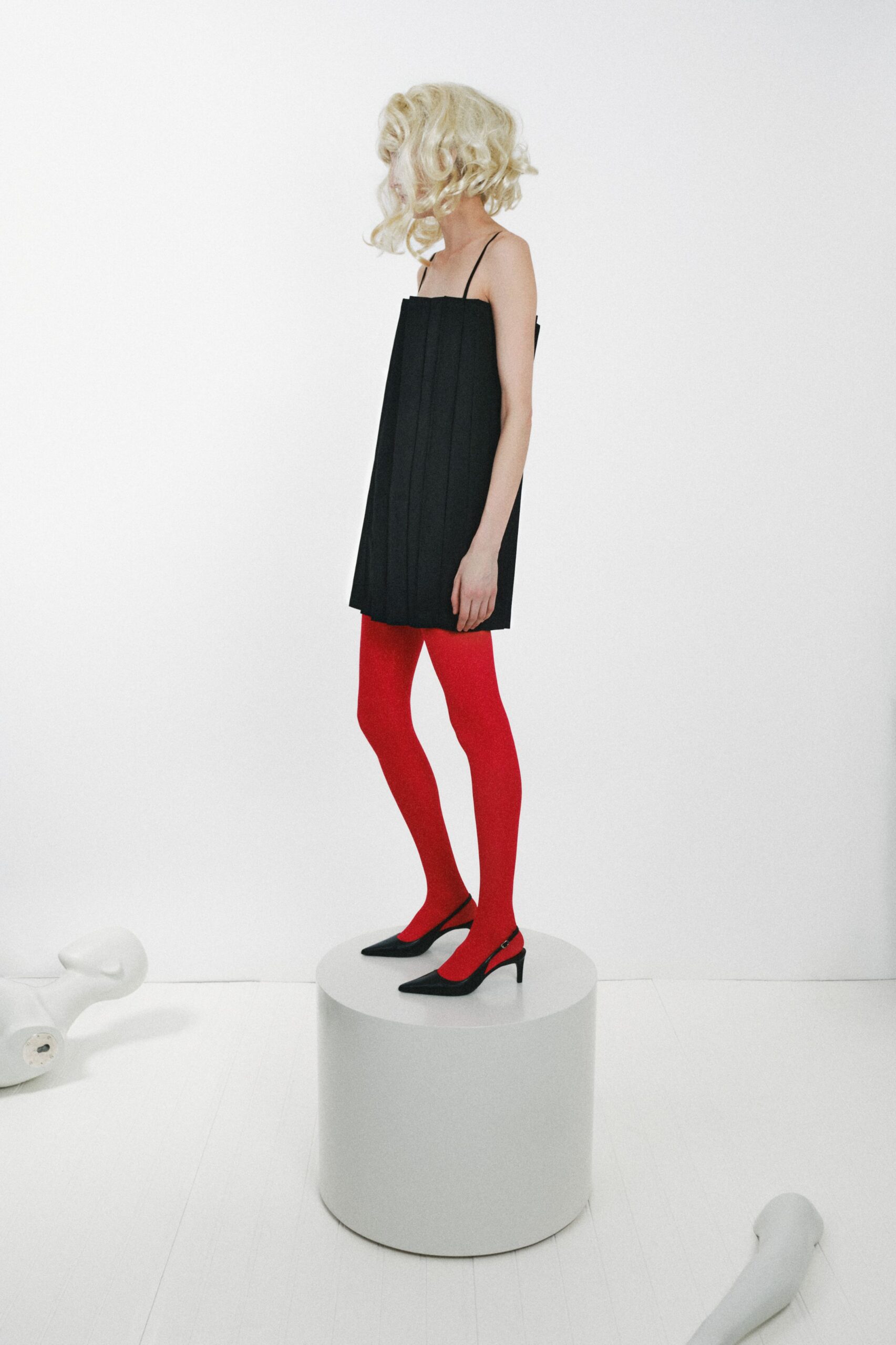black pleated spaghetti-strap mini dress