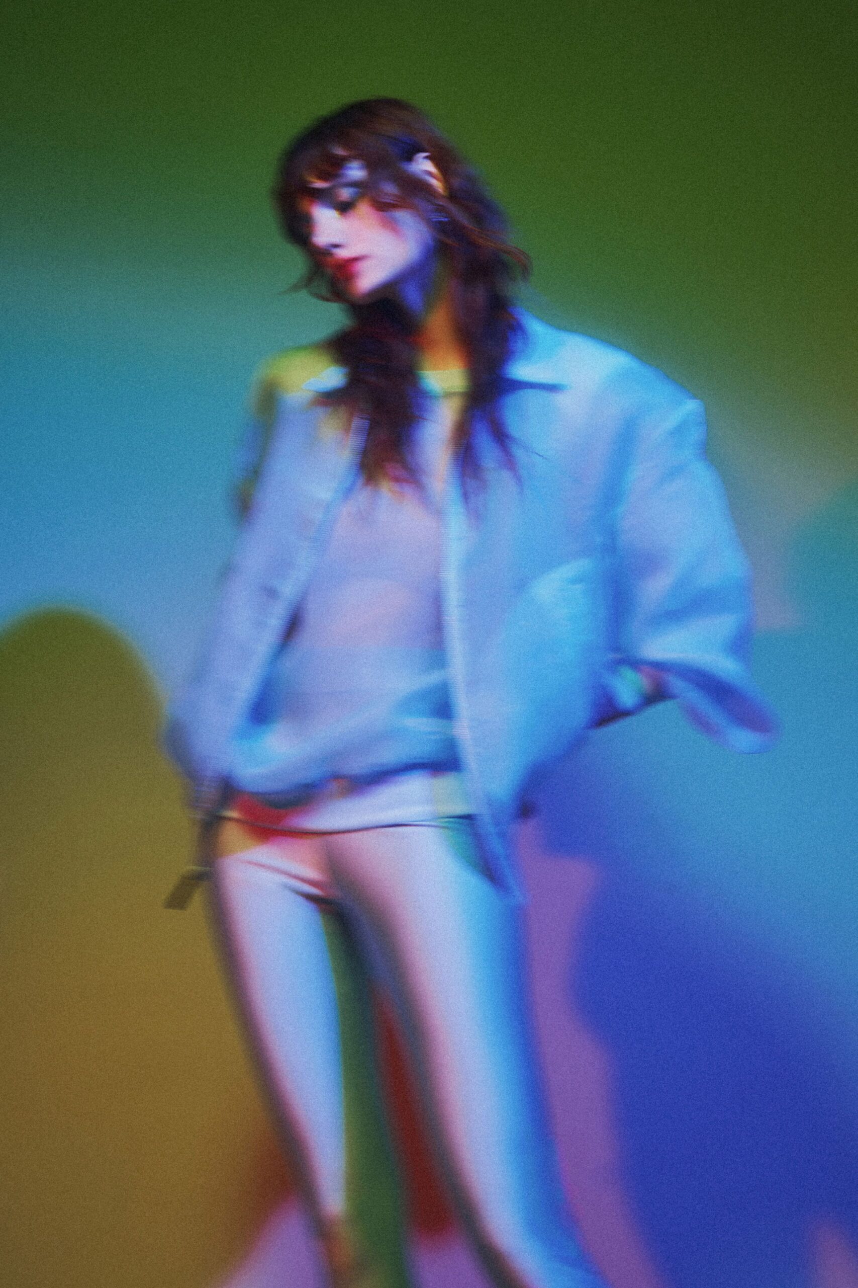 Pale padded bomber, rib collar and zip catching the light. Cream fine-knit sweater with a clean crew neck. Pearly white leggings, smooth as liquid under the colored wash. Waiting for the elevator after midnight, hallway carpet still warm.